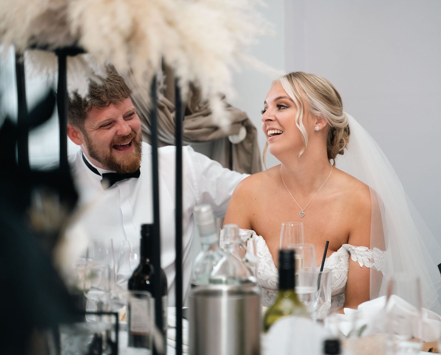 Bride and groom laughing during wedding speeches at Triton Inn – captured candidly by Hull wedding photographer