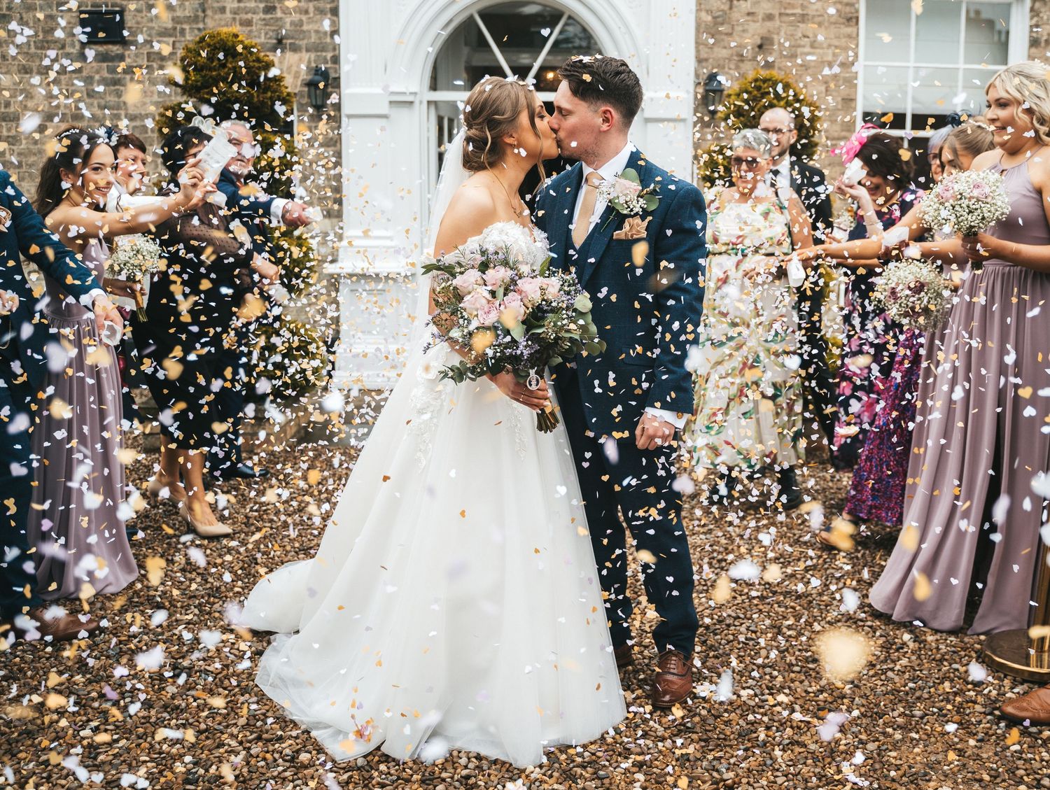 Confetti moment at Dunedin country house, captured by a documentary style photographer in East Yorkshire.