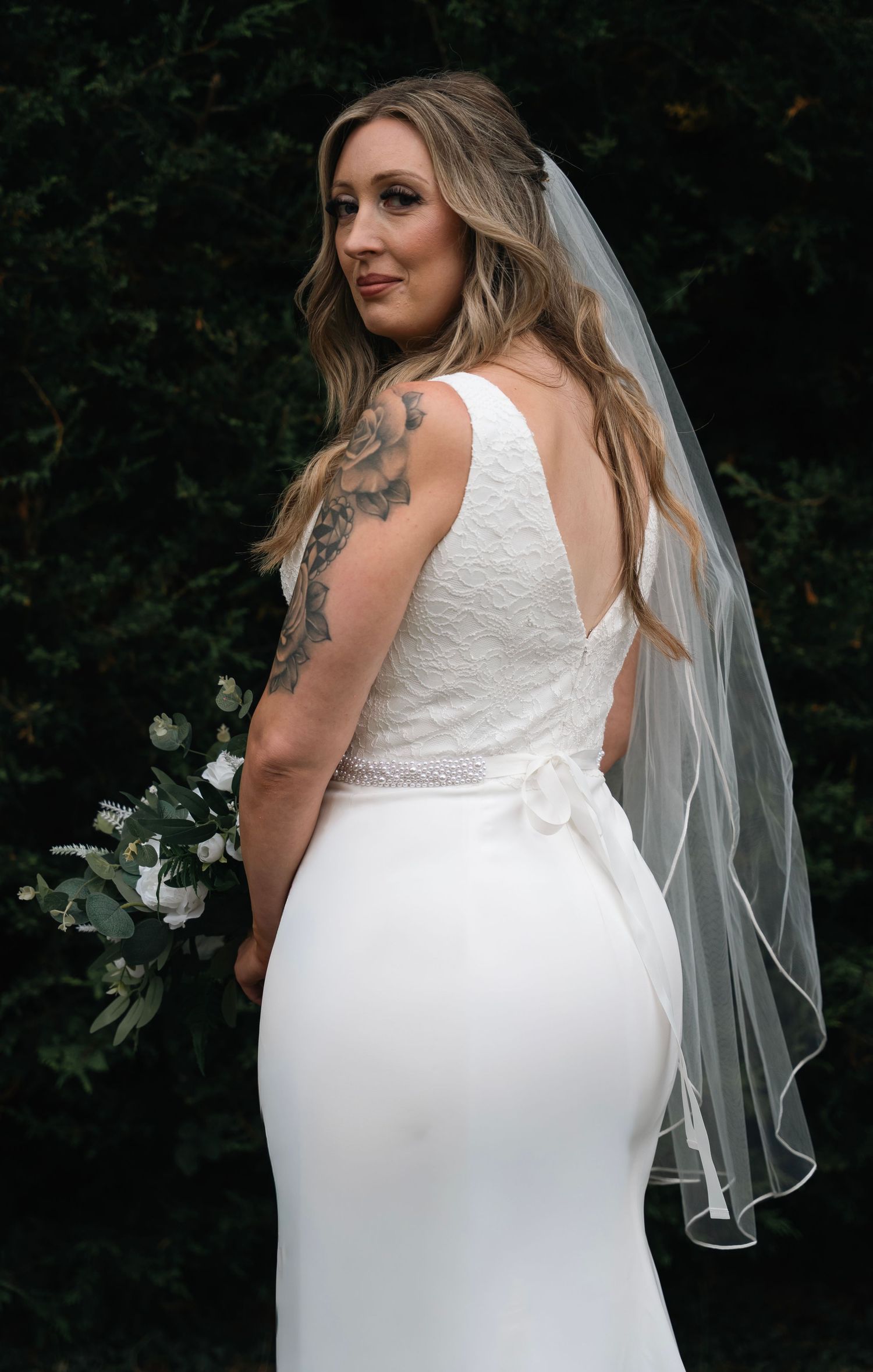 Bride with her bouquet at the Gardeners Country Inn wedding