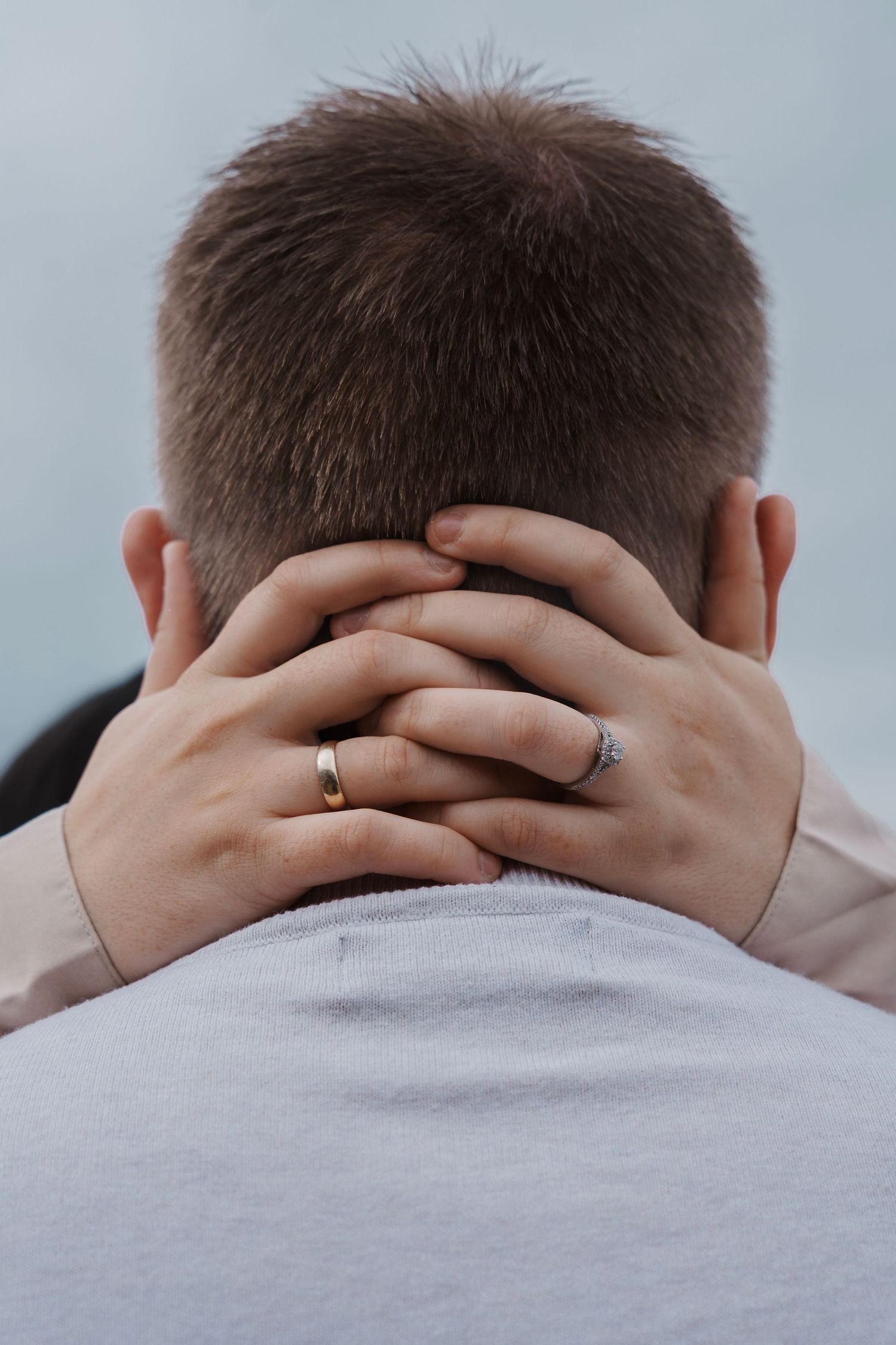 couple showing their engagement ring during their engagement shoot, taken by a Yorkshire wedding photographer at Grand villa heights