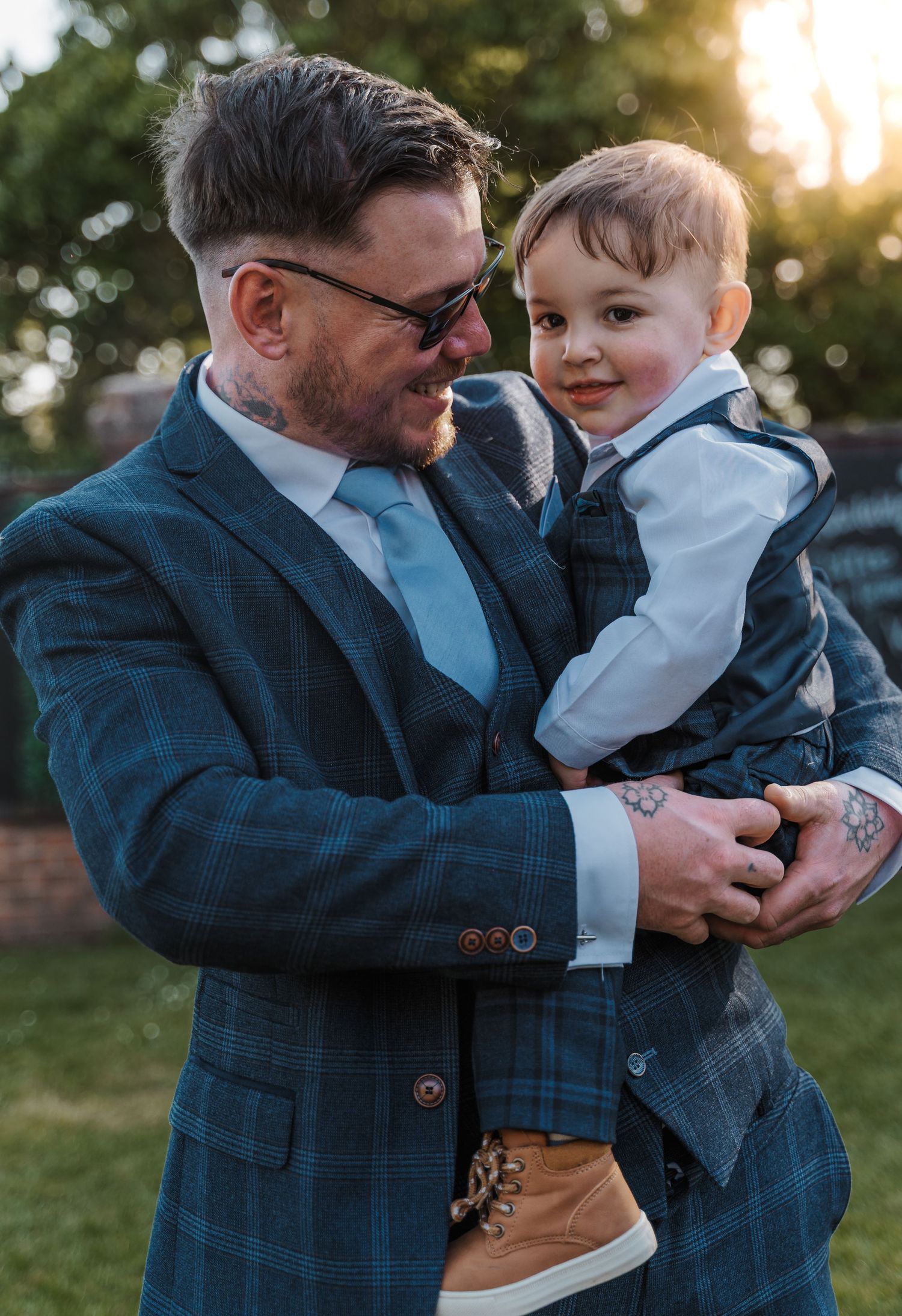 Groom with his son portrait at the Gardeners country inn, captured by a candid East Yorkshire wedding Photographer