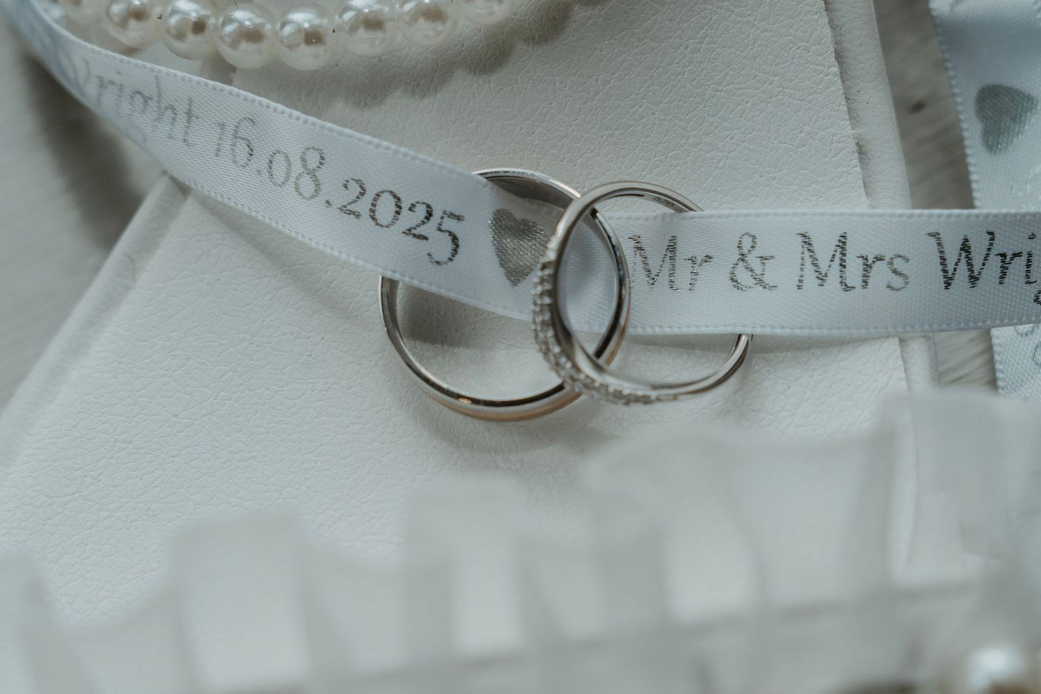 wedding rings in the brides laces, taken at Lazaat Hotel in Cottingham, captured by a candid wedding photographer in East Yorkshire.