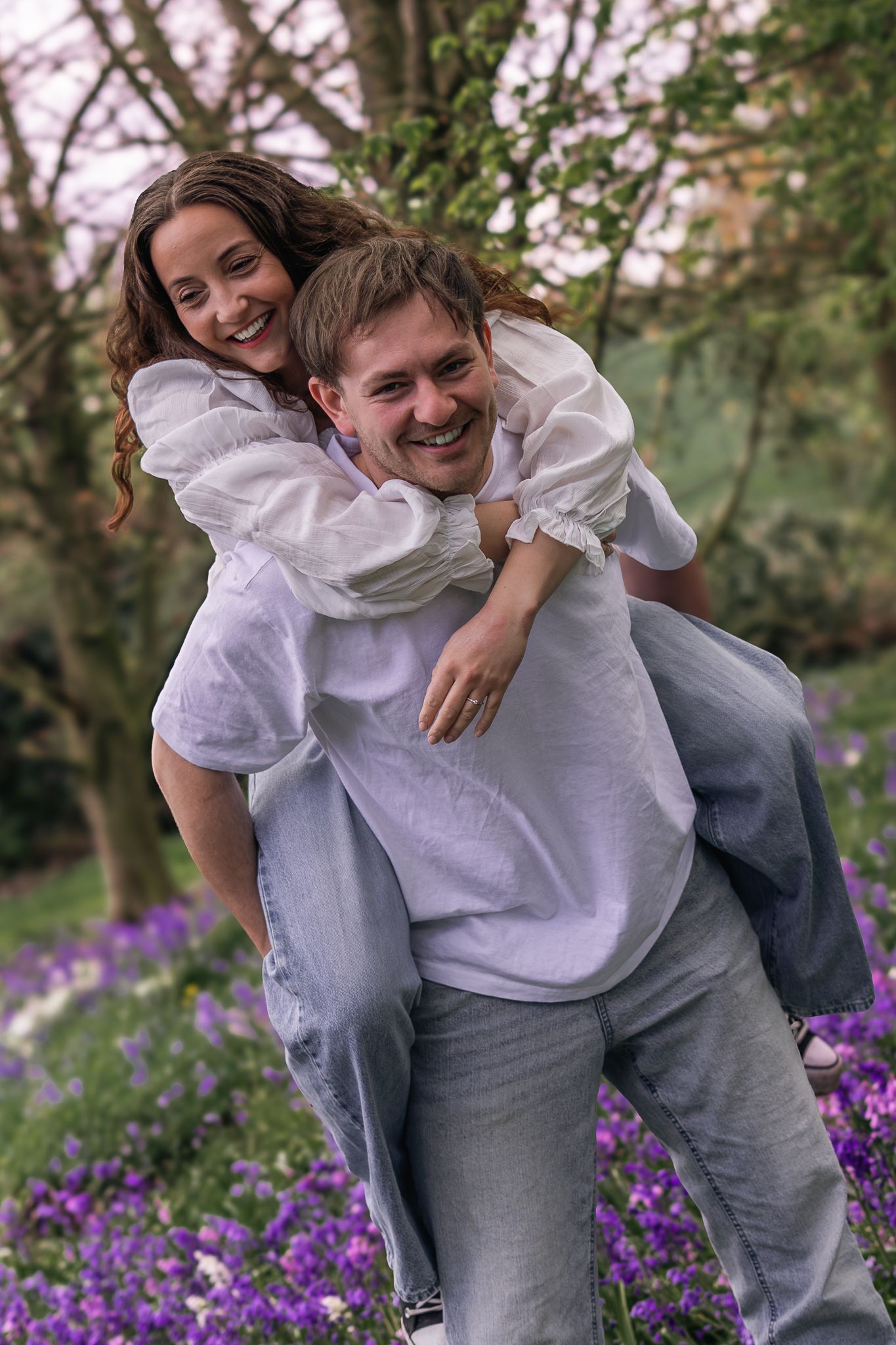 couple laughing and having fun during their engagement shoot, taken by a Yorkshire wedding photographer In east Yorkshire