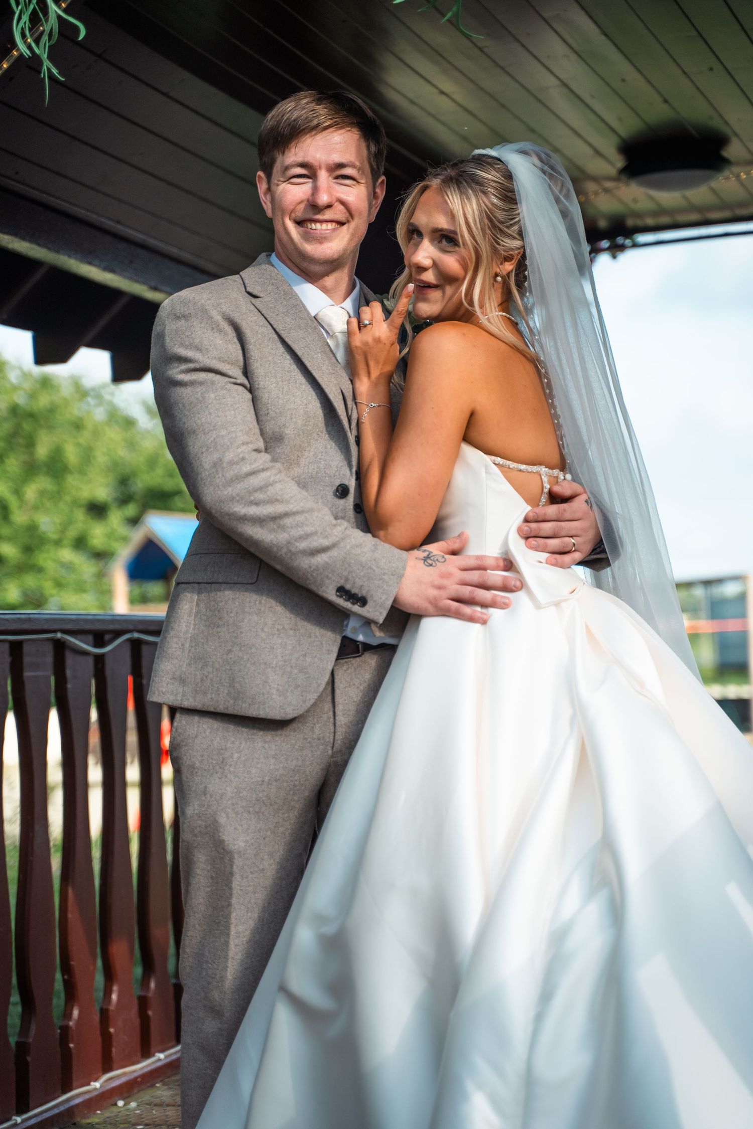 Bride striking a playful pose to make groom laugh at Gardeners Country Inn – captured by Hull documentary wedding photographer