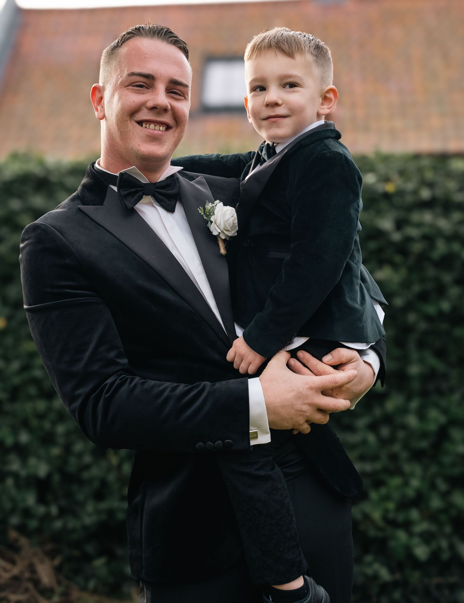 Groom and his son at their home during the groom preparations