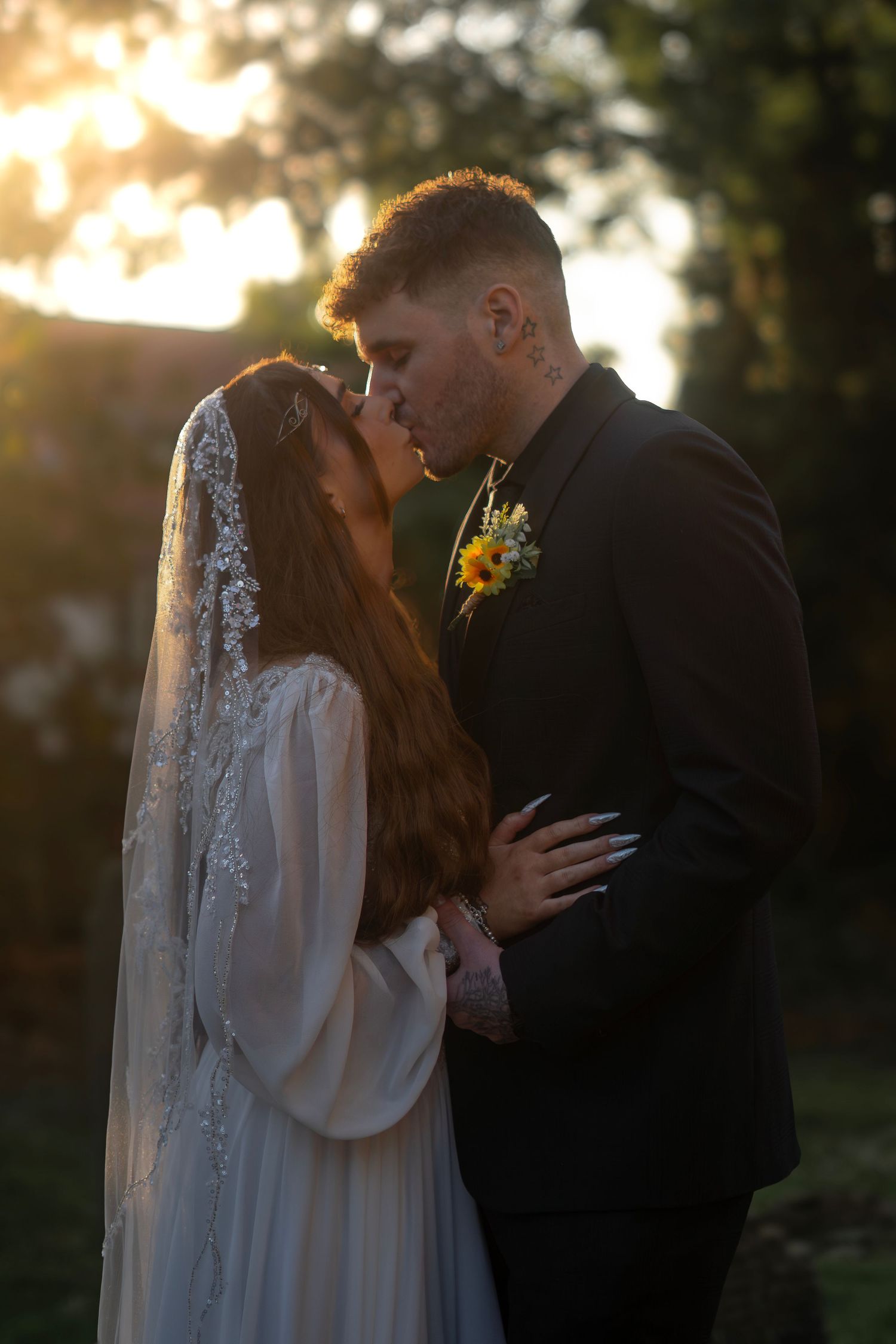 bride and groom kiss at sunset in Hornsea, east yorkshire