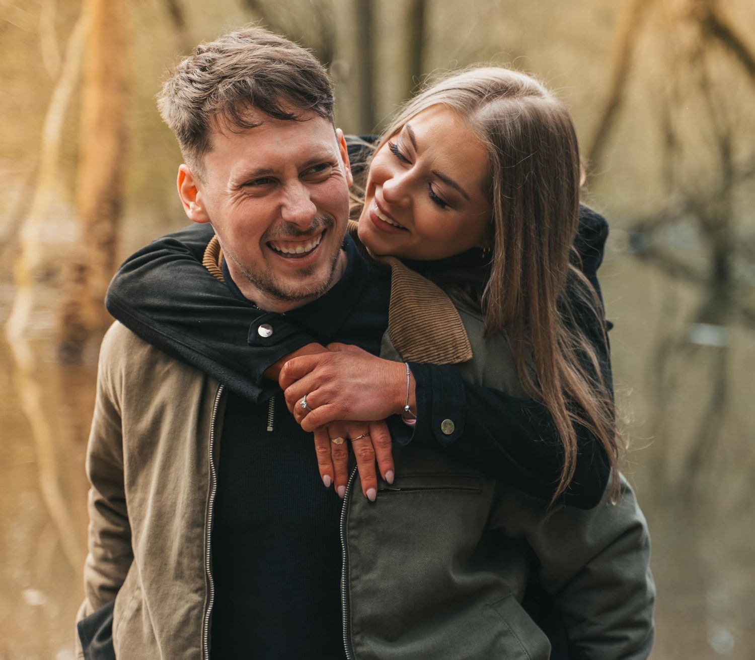 Couple hugging and smiling during their engagement shoot, taken by a Yorkshire wedding photographer in Hull