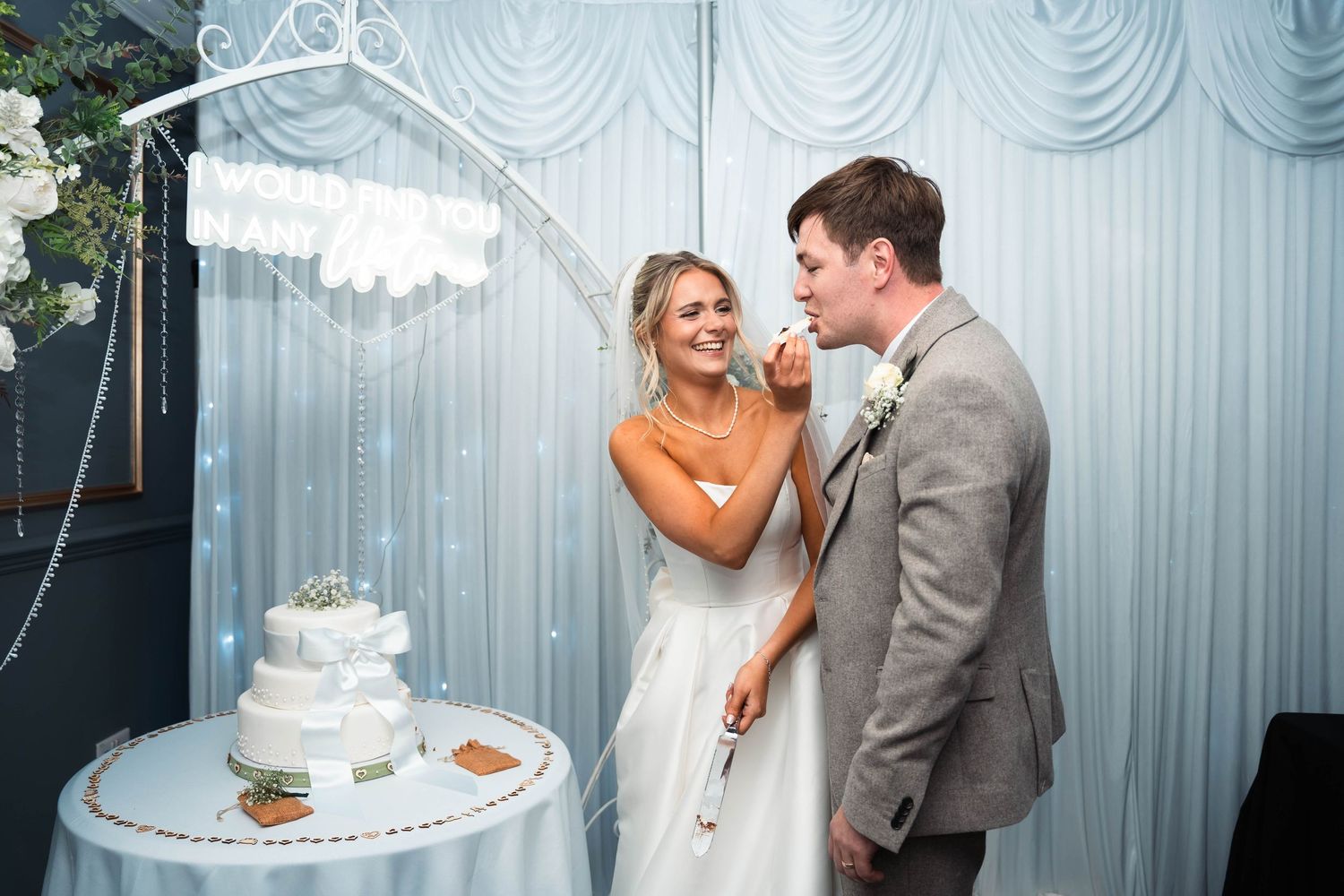 Bride feeding the groom some of their wedding cake at the Gardeners country inn, captured by a candid East Yorkshire wedding Photographer
