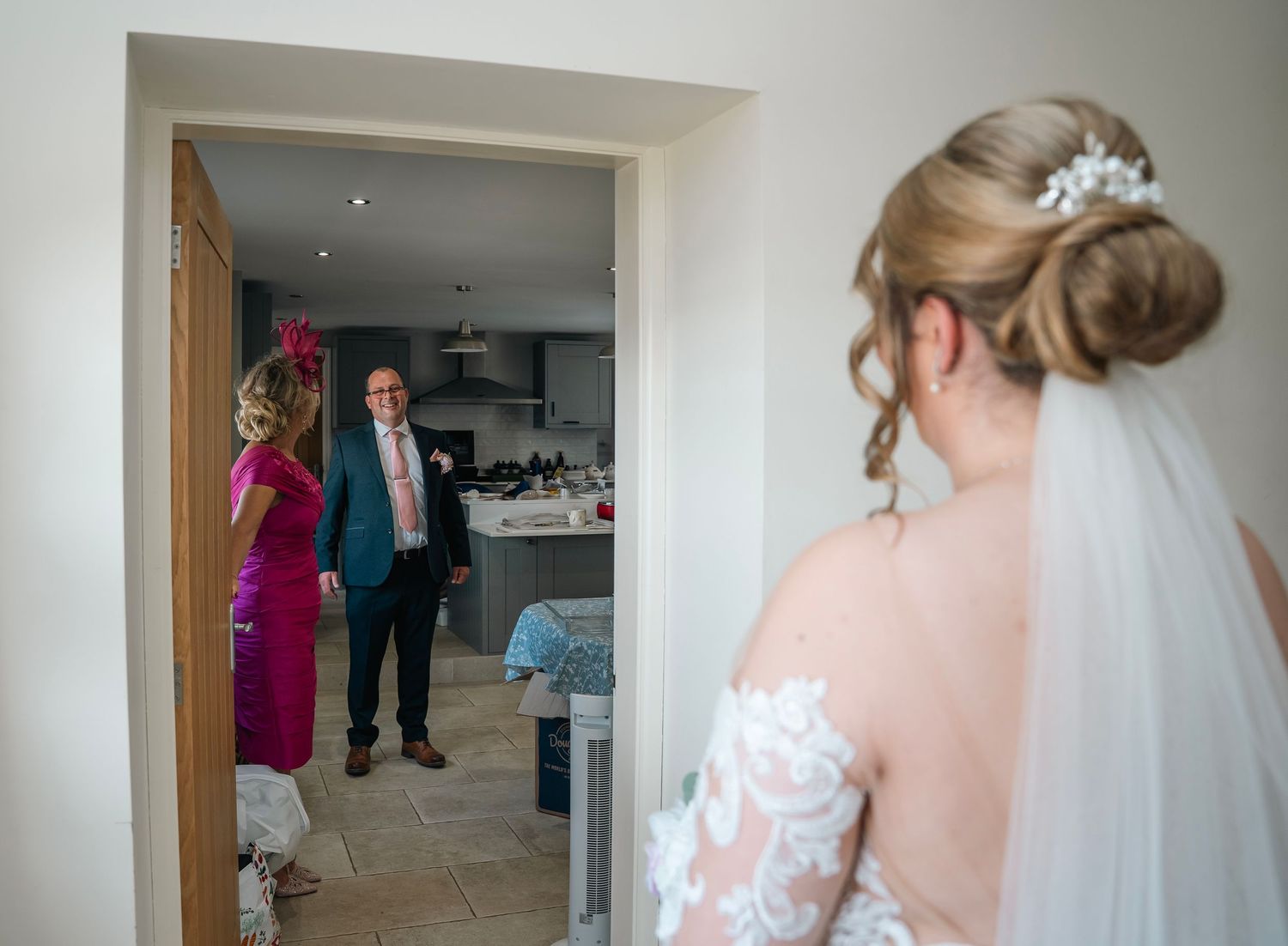 Dads first look with the bride before the wedding at her home, captured by candid wedding photographer in Yorkshire