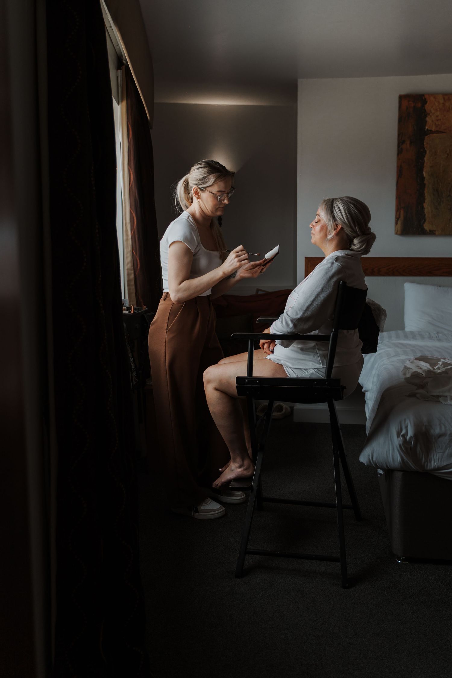 Bride having her makeup done at Lazaat Hotel in Cottingham, captured by Candid wedding Photographer in Hull