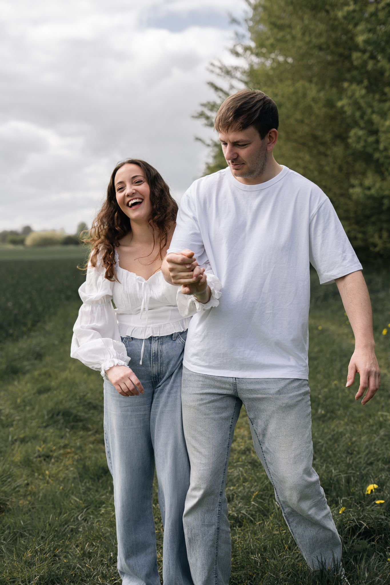 couple laughing and having fun during their engagement shoot, taken by a Yorkshire wedding photographer In east Yorkshire