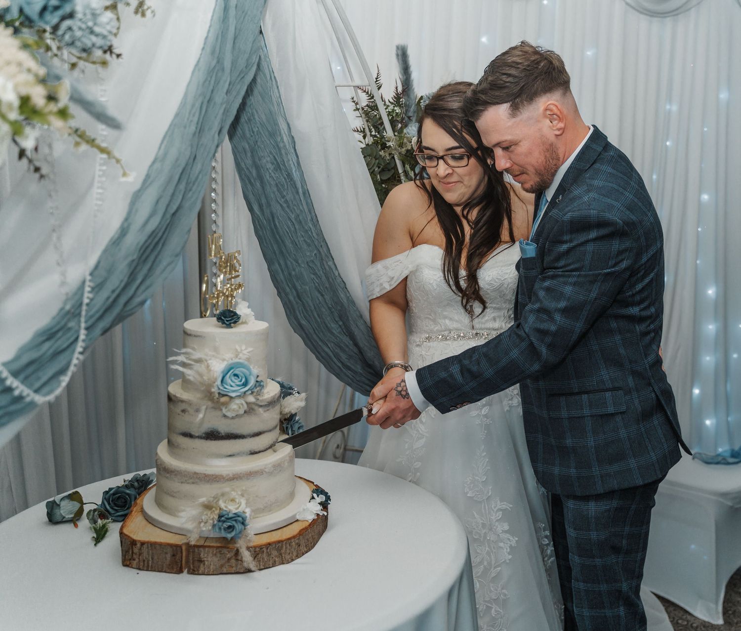 Bride and groom cutting their wedding cake at The gardeners country inn, captured by a wedding photographer in East Yorkshire