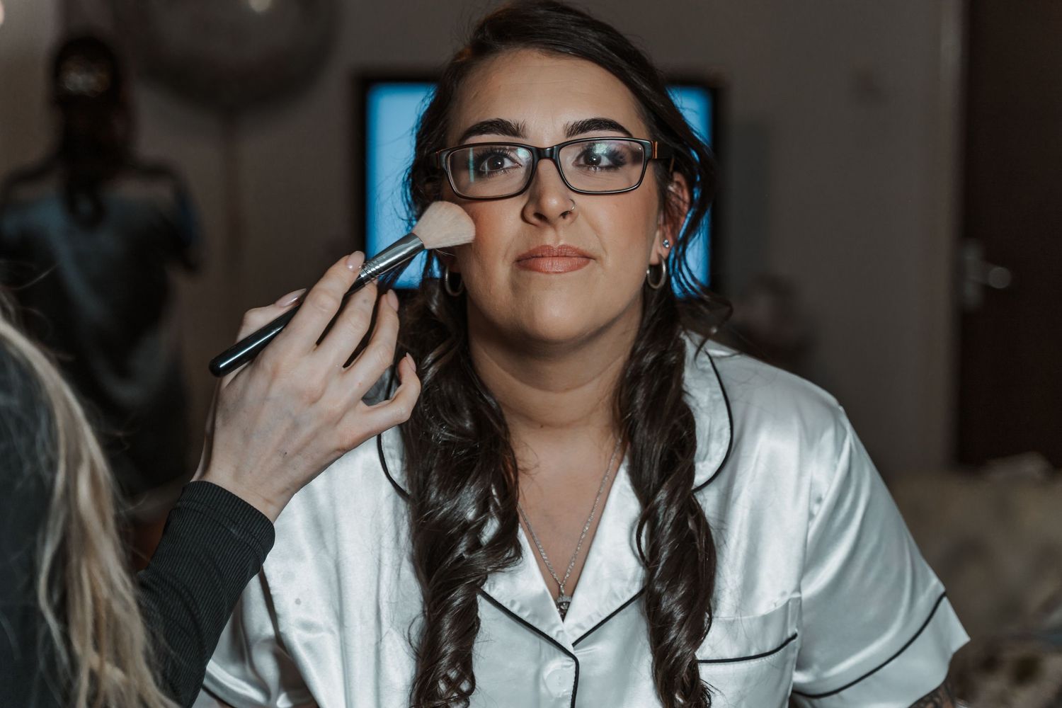 Bride having her make up done at the Gardeners country inn, captured by a candid East Yorkshire wedding Photographer