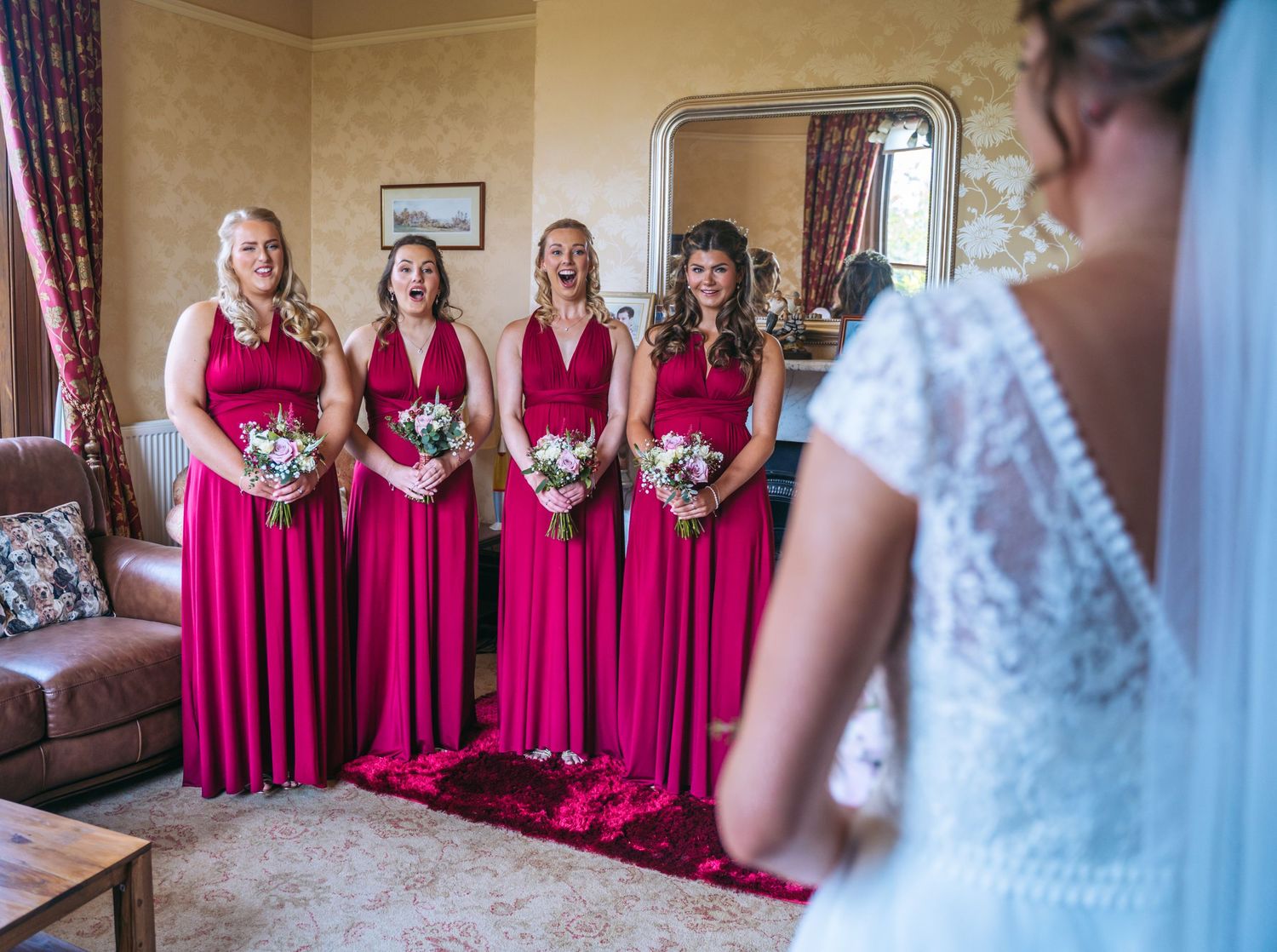 Brides maids seeing the bride at a farm wedding in east Yorkshire, captured by a Hull wedding photographer