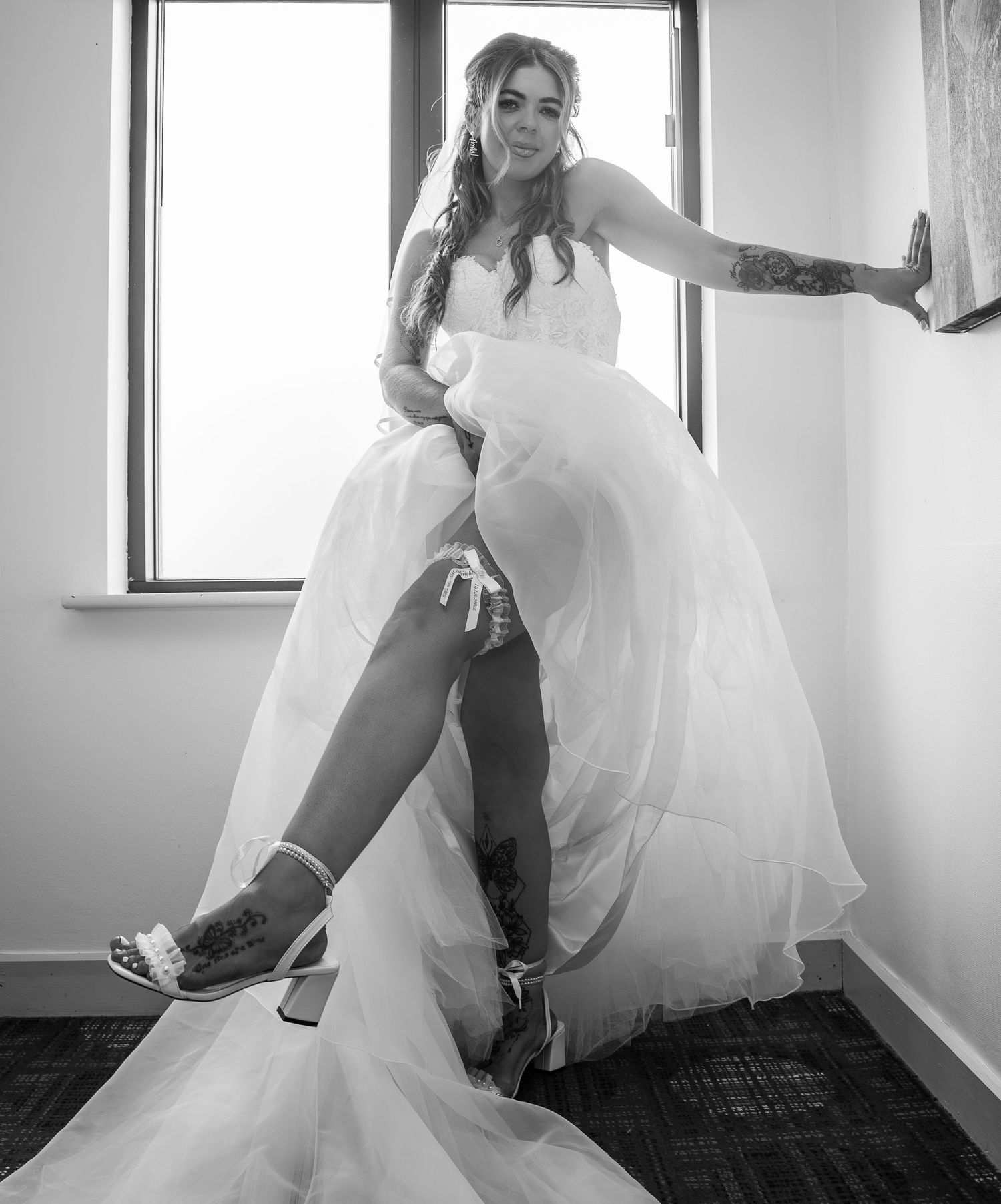 Bride with her garter at Lazaat Hotel, captured by an east Yorkshire wedding photographer.
