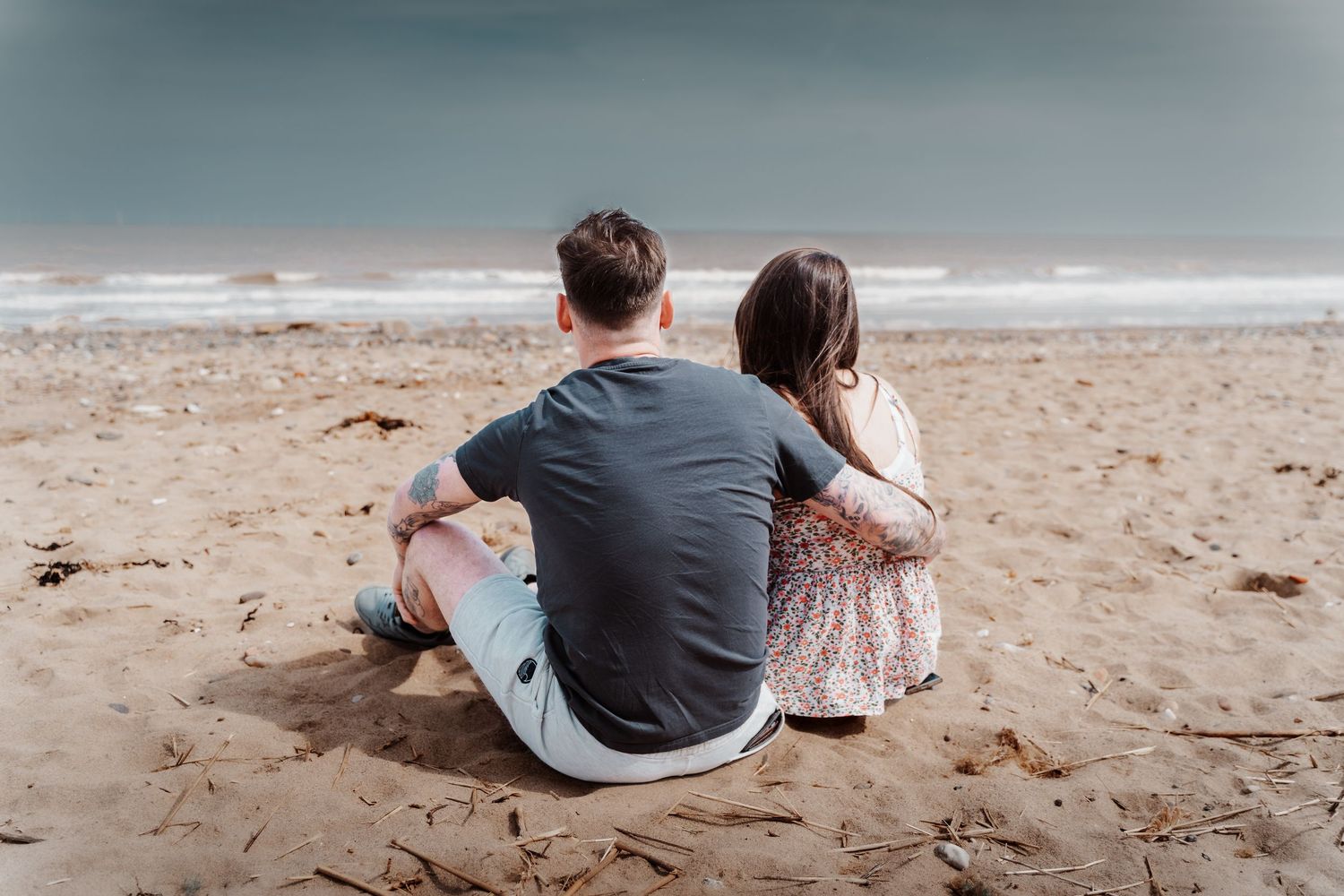 Couple enjoying the beach during their engagement shoot, taken by a Yorkshire wedding photographer in Hull