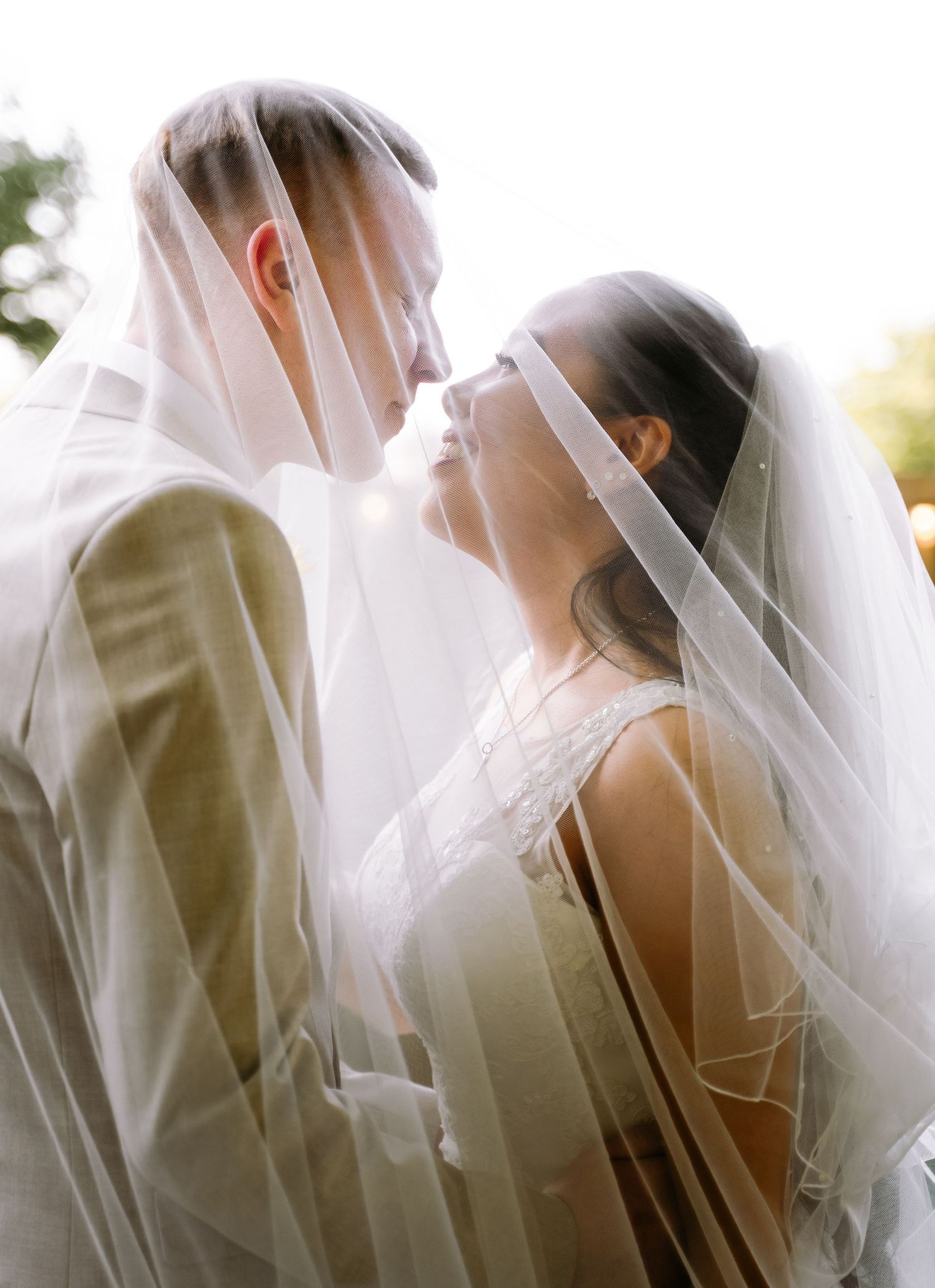 Brides and groom under the veil at Mercure hotel Hull, captured by a candid East Yorkshire wedding Photographer