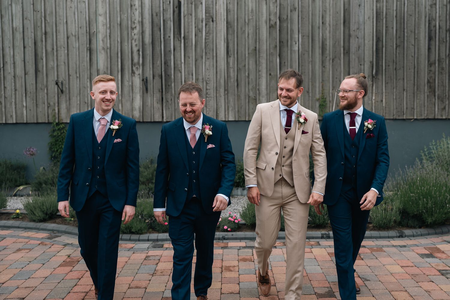Groom and his groomsmen walking around The Barn at Willerby during groom preparations