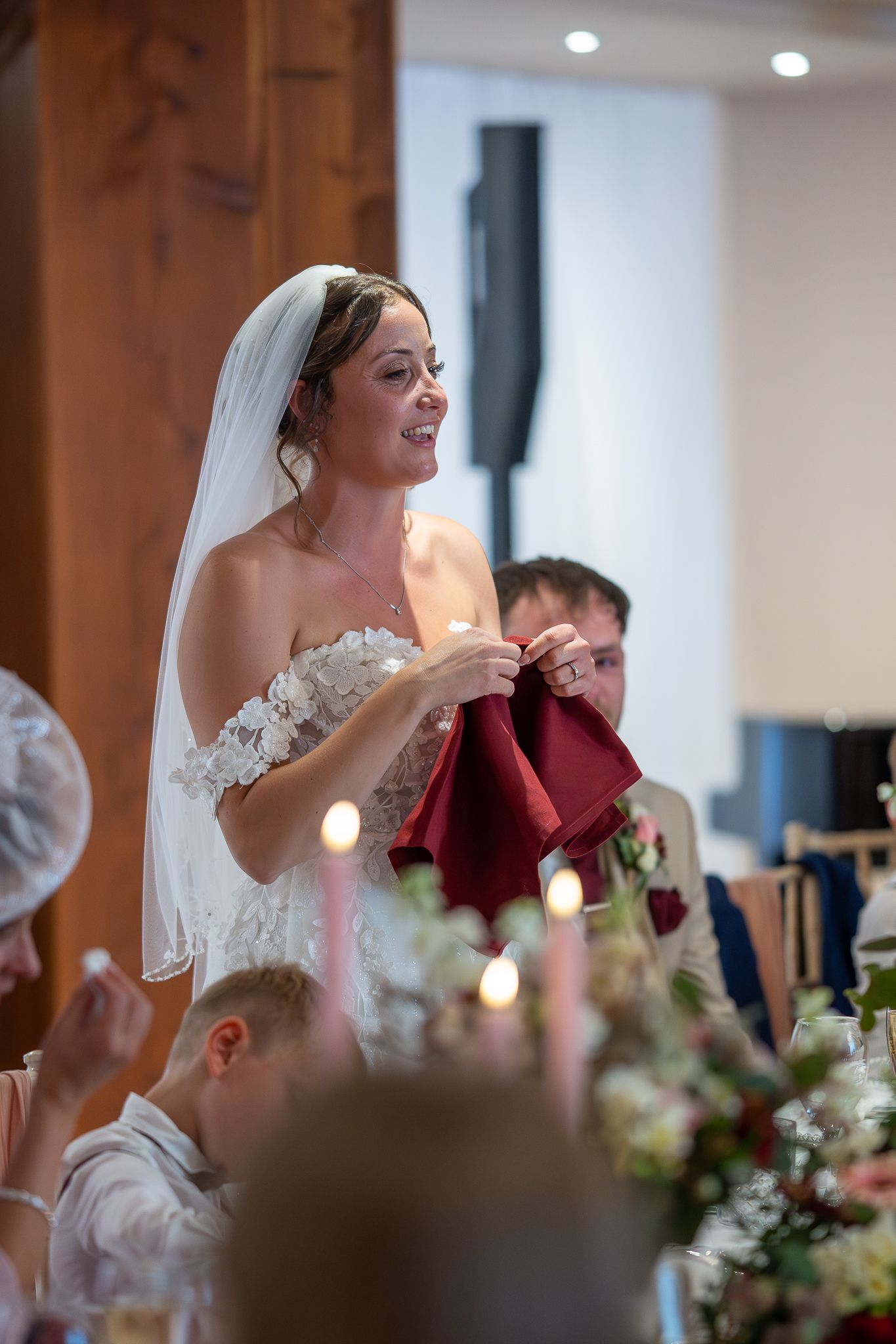 Bride smiling during the wedding speeches at The Barn at Willerby.