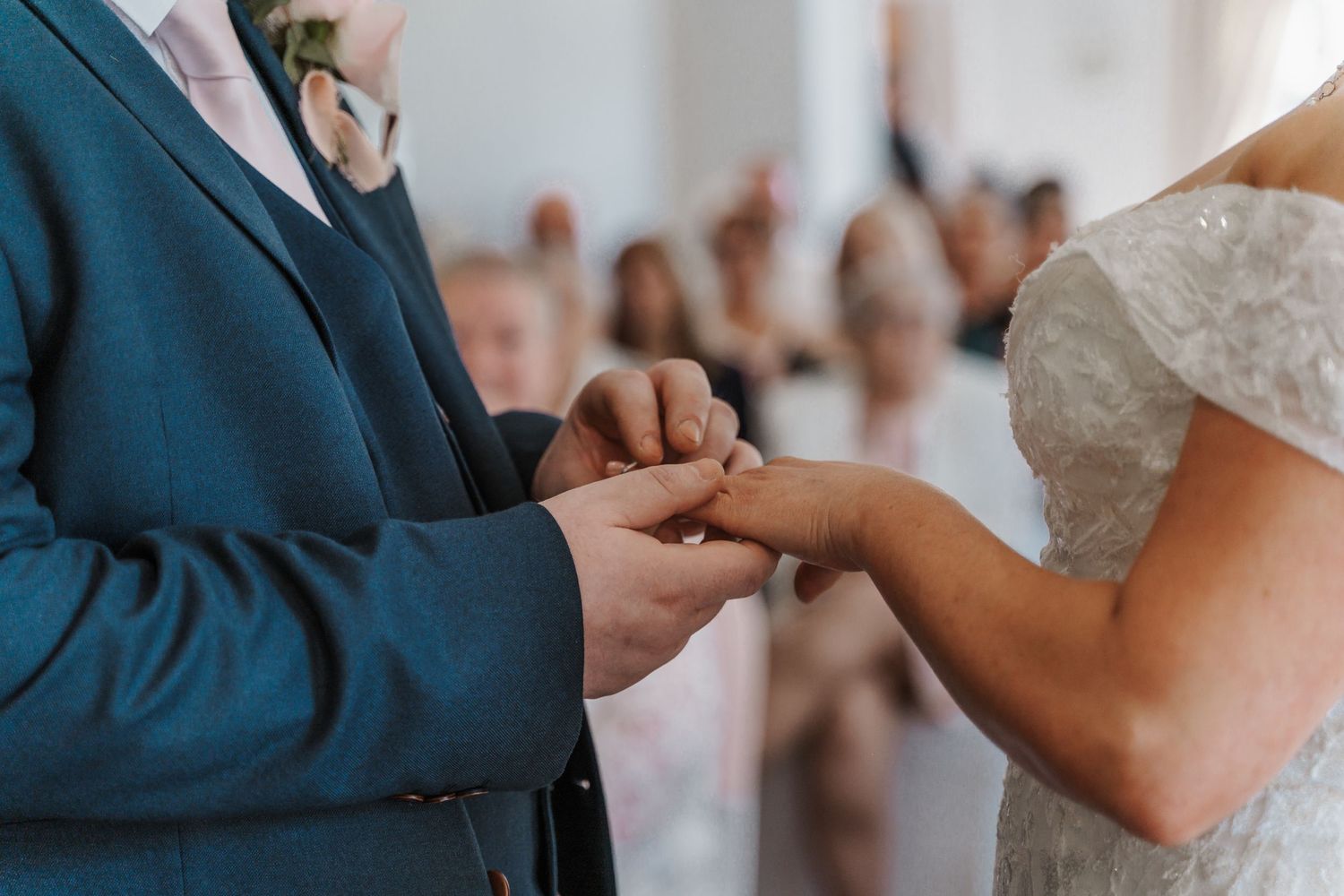 Exchanging rings during the wedding ceremony at Lazaat Hotel in Cottingham, captured by East yorkshire wedding photographer
