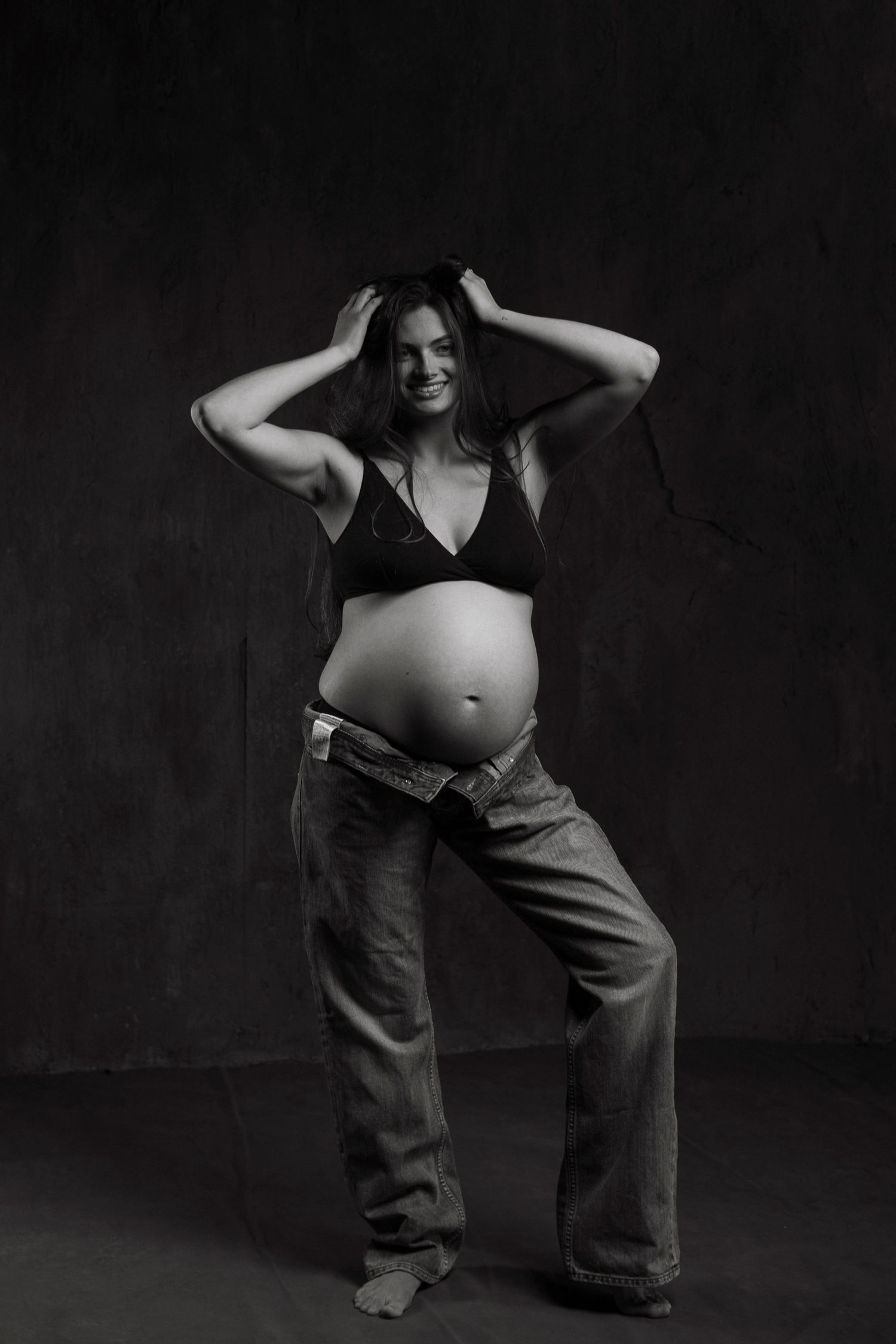 Expressive black and white maternity photos showcase movement and casual style.