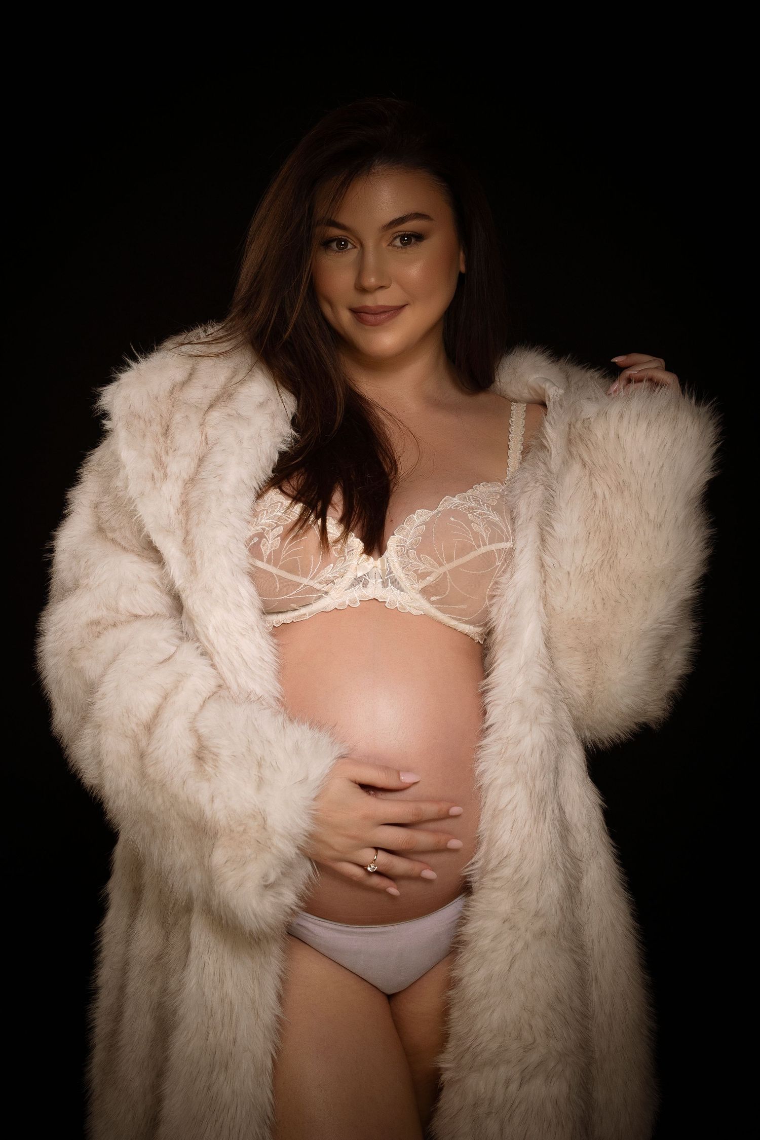 Artistic boudoir photo series showing model in white fur coat against dark background.