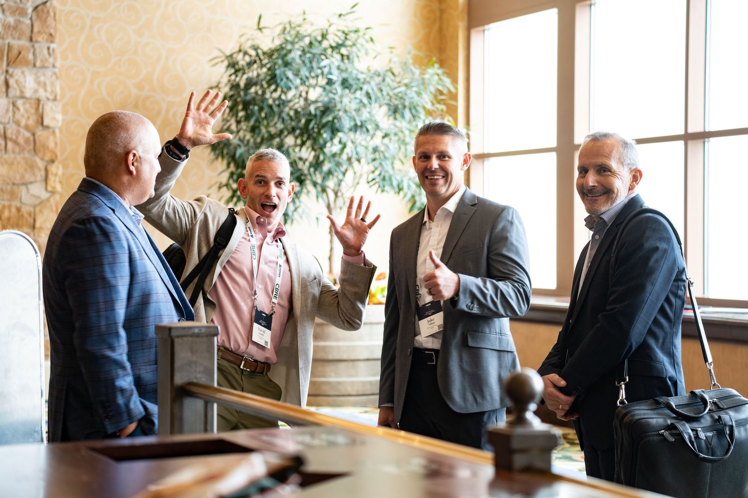 Business colleagues having animated discussion in modern office space.
