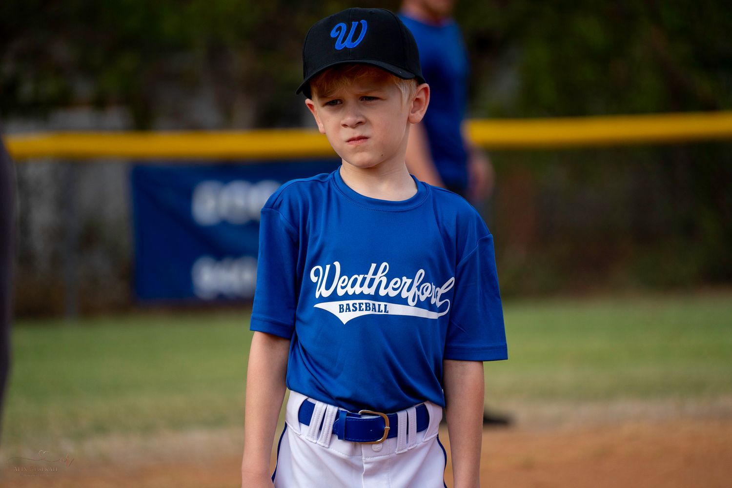 A collage of youth baseball players in blue jerseys and uniforms practicing and playing on a baseball diamond.