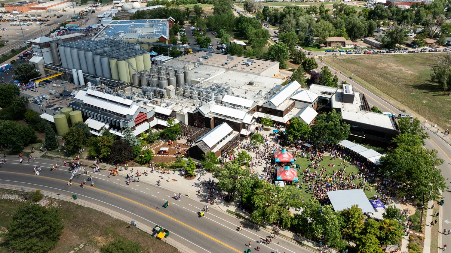 Aerial view of industrial facilities and buildings with roads and infrastructure.