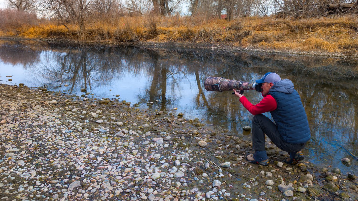 A series of nature photos showing someone exploring and photographing along a rocky riverbank in autumn. Dave Cho