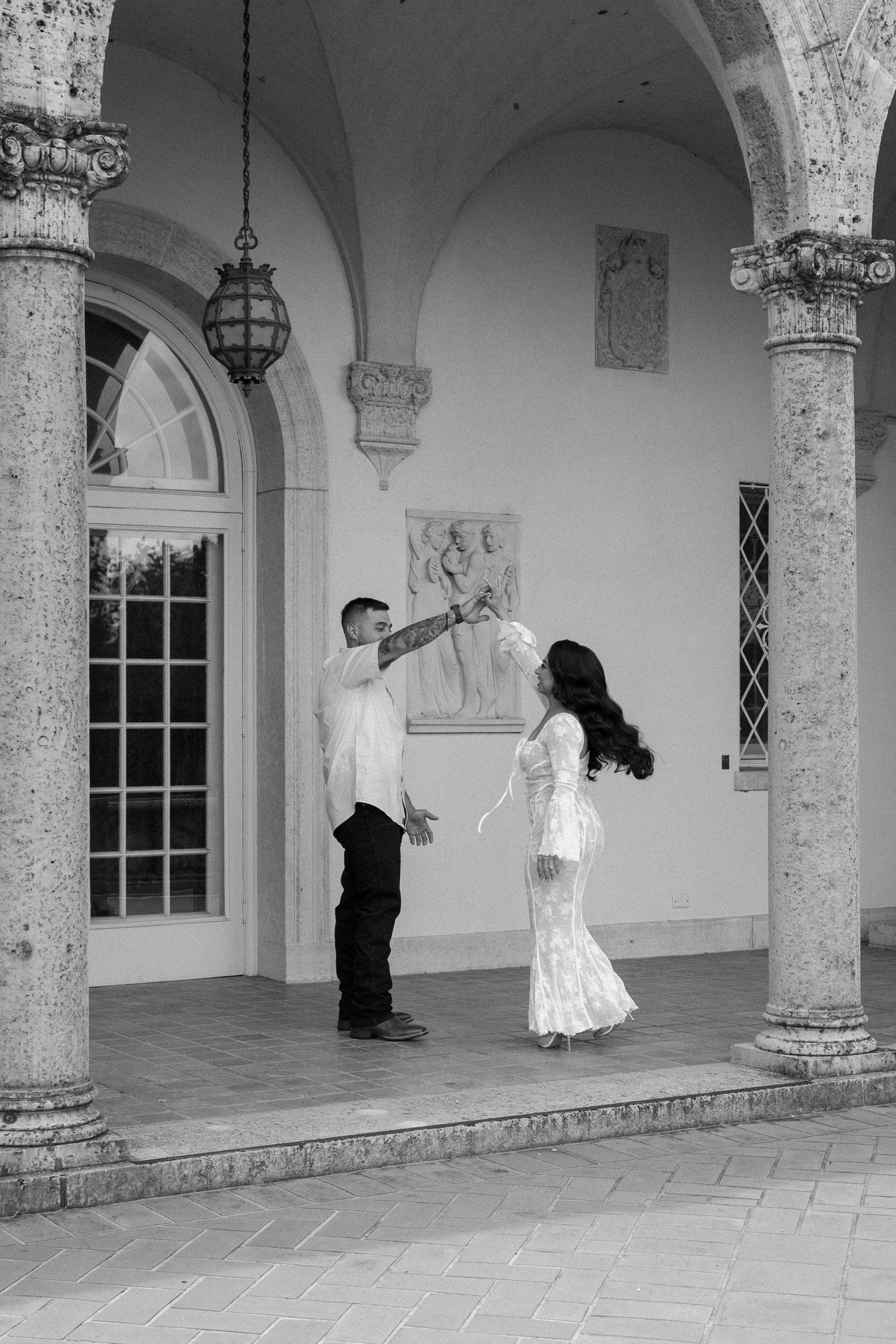 Bride and groom posing in an editorial manner during their wedding day.