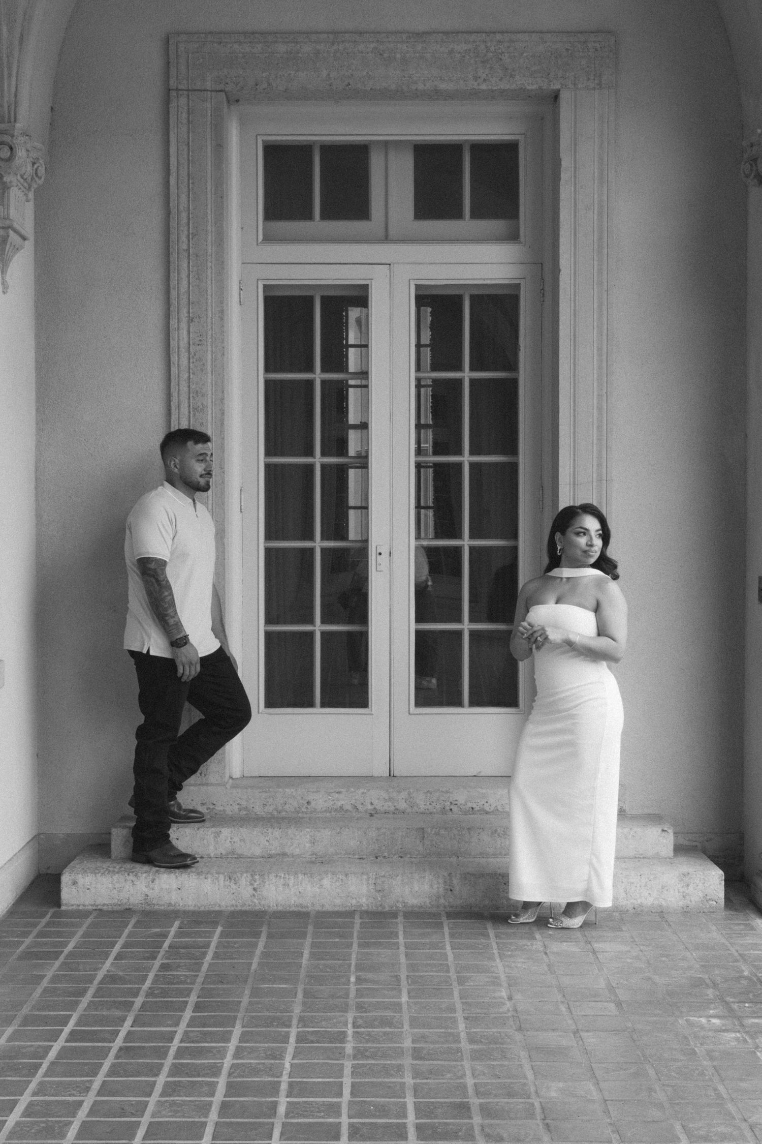Bride and groom posing in an editorial manner during their engagement session.