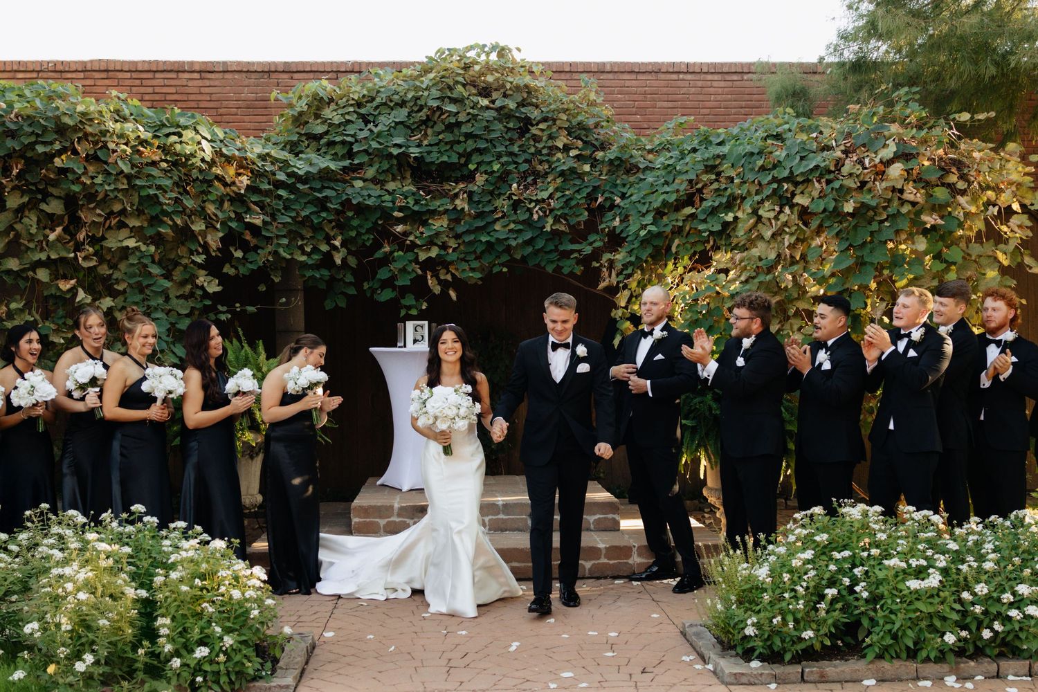 Bride and groom posing in an editorial manner during their wedding day.