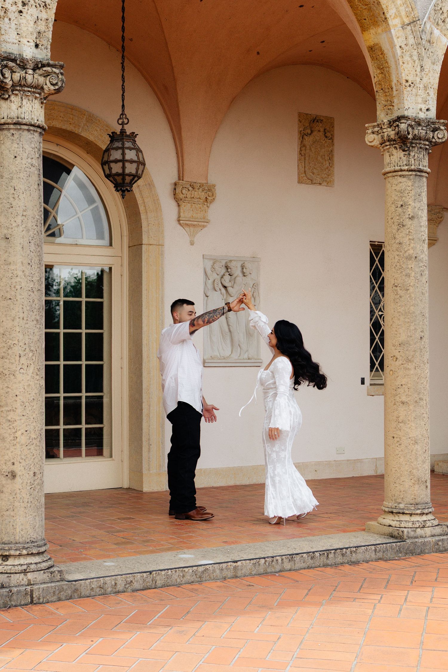 Bride and groom posing in an editorial manner during their wedding day.