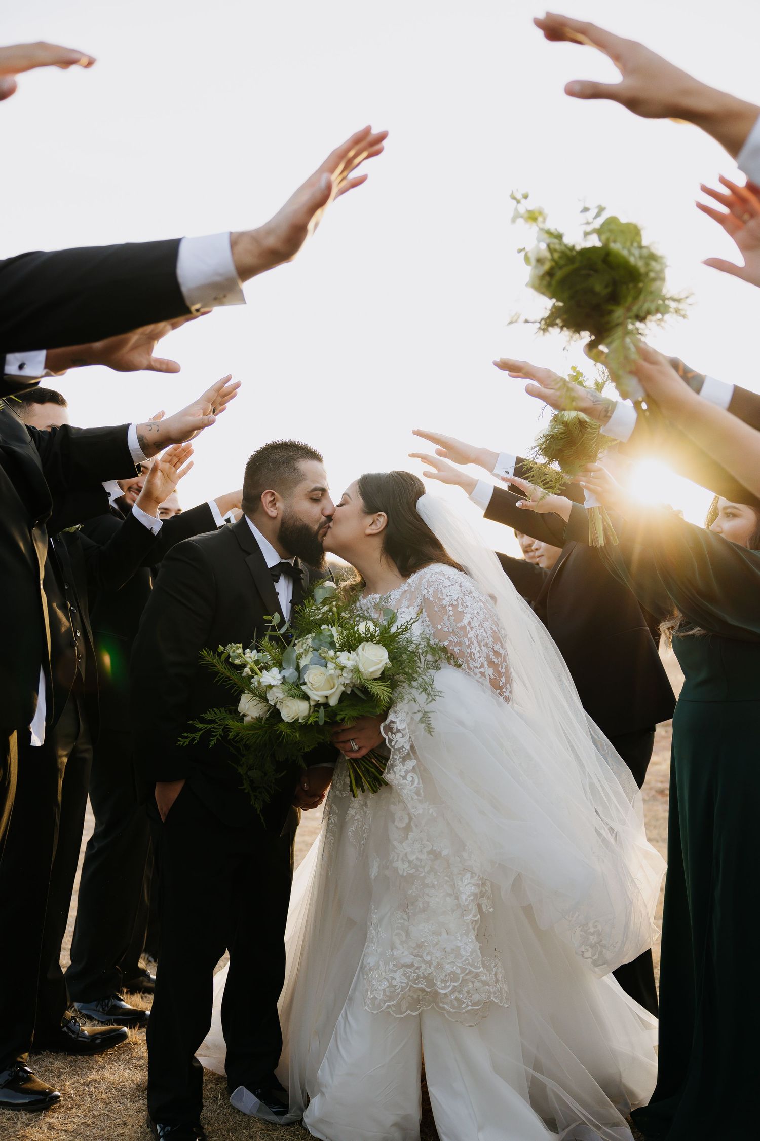Bride and groom posing in an editorial manner during their wedding day.