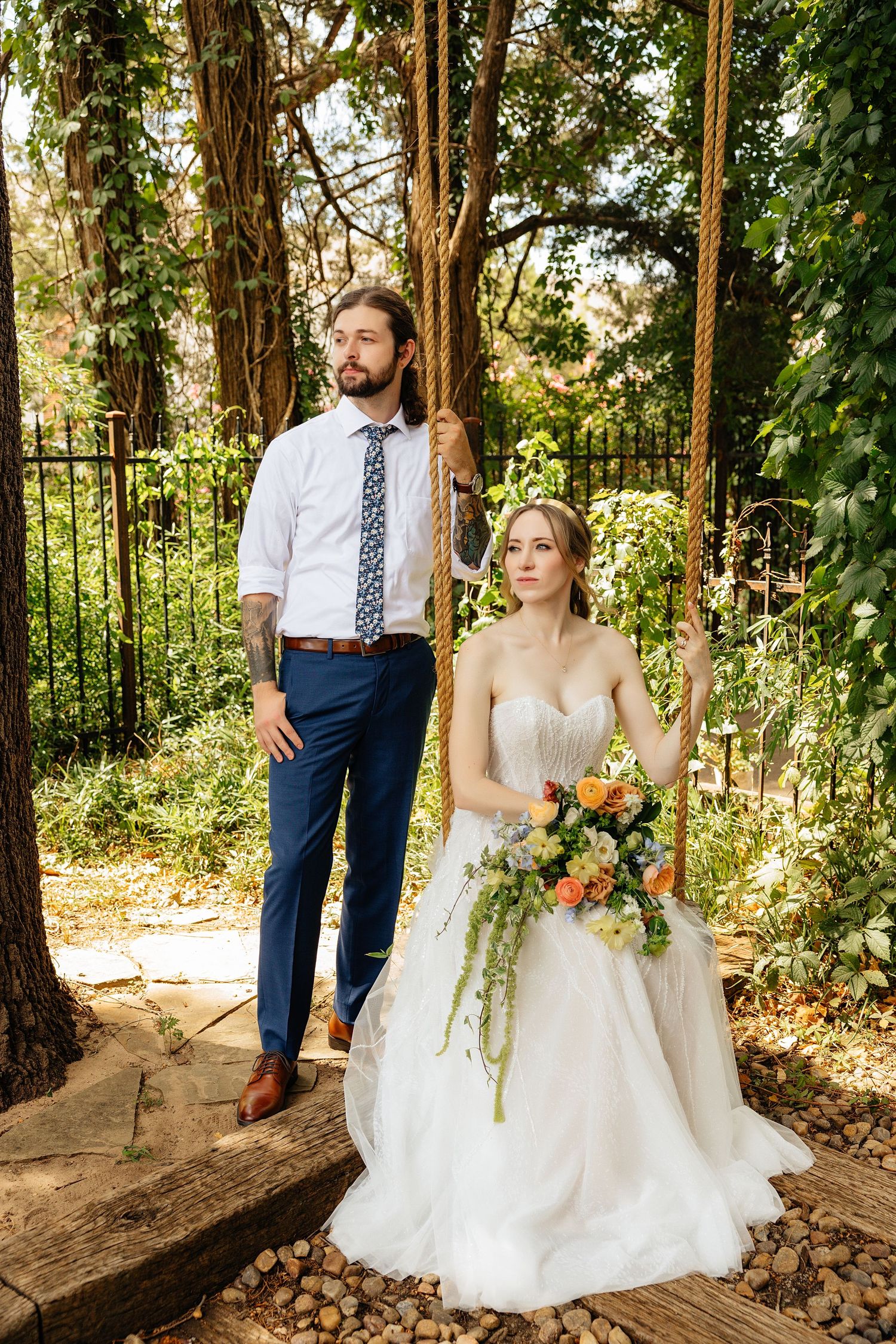 Bride and groom posing in an editorial manner during their wedding day.