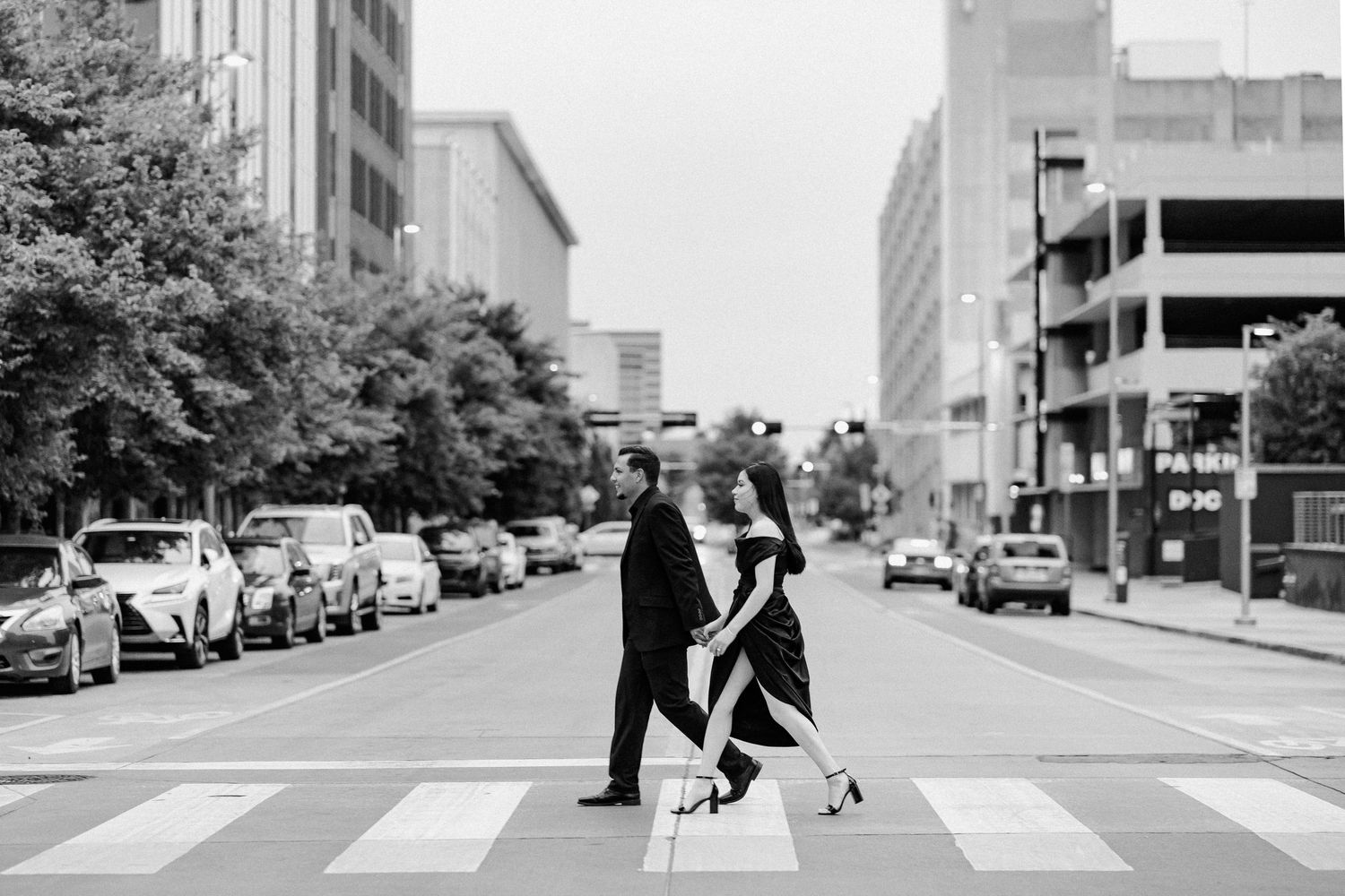 Black and white photo of fiance's posing in an editorial manner during their engagement session.