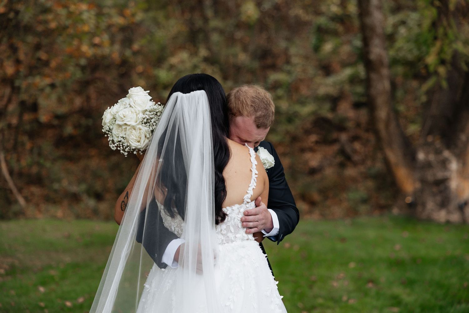 Bride and groom posing in an editorial manner during their wedding day.