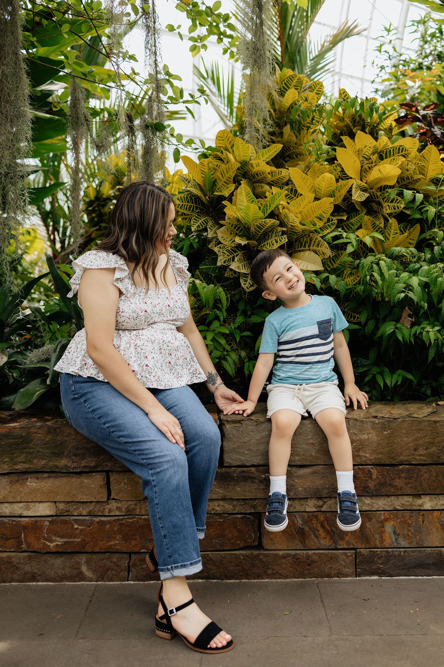 Mother and son during their photoshoot inside of the Myriad Gardens Conservatory in Oklahoma City, Oklahoma.