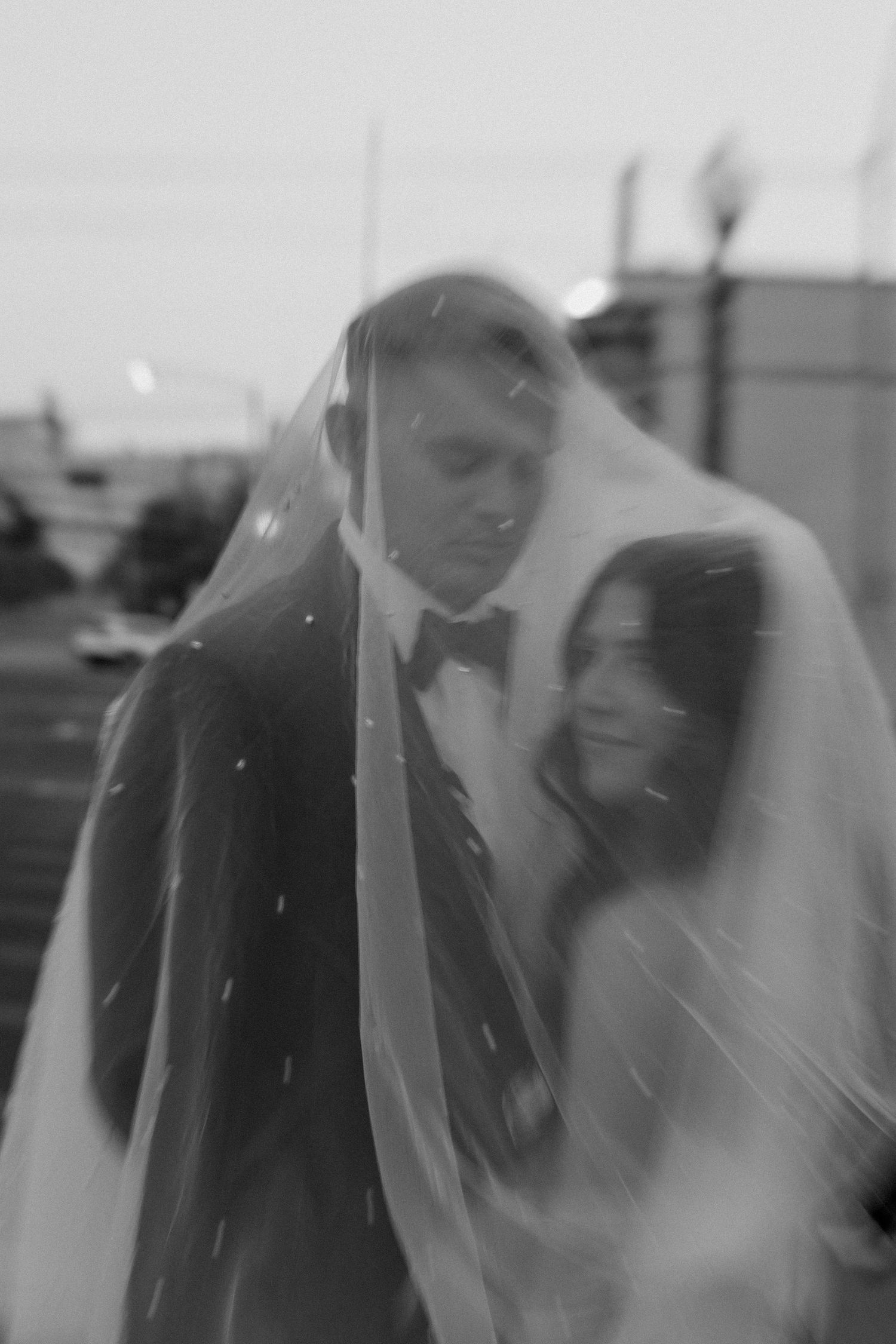 Bride and groom posing in an editorial manner during their wedding day.