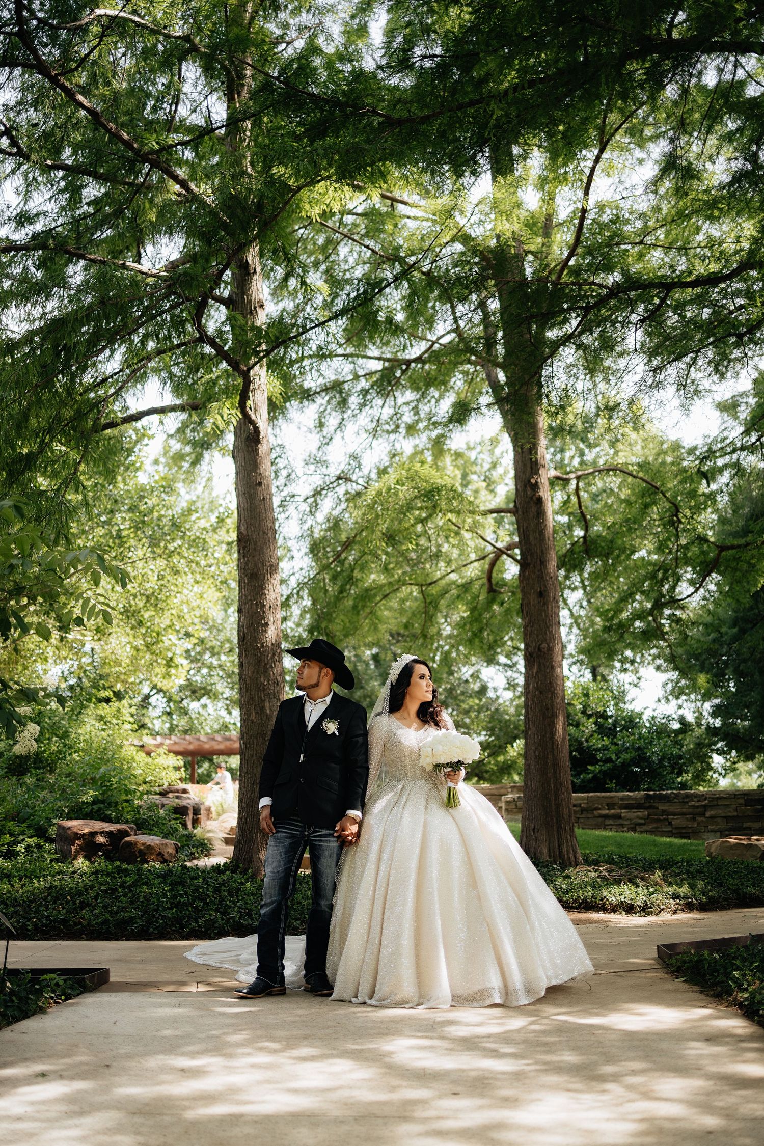 Bride and groom posing in an editorial manner during their wedding day.