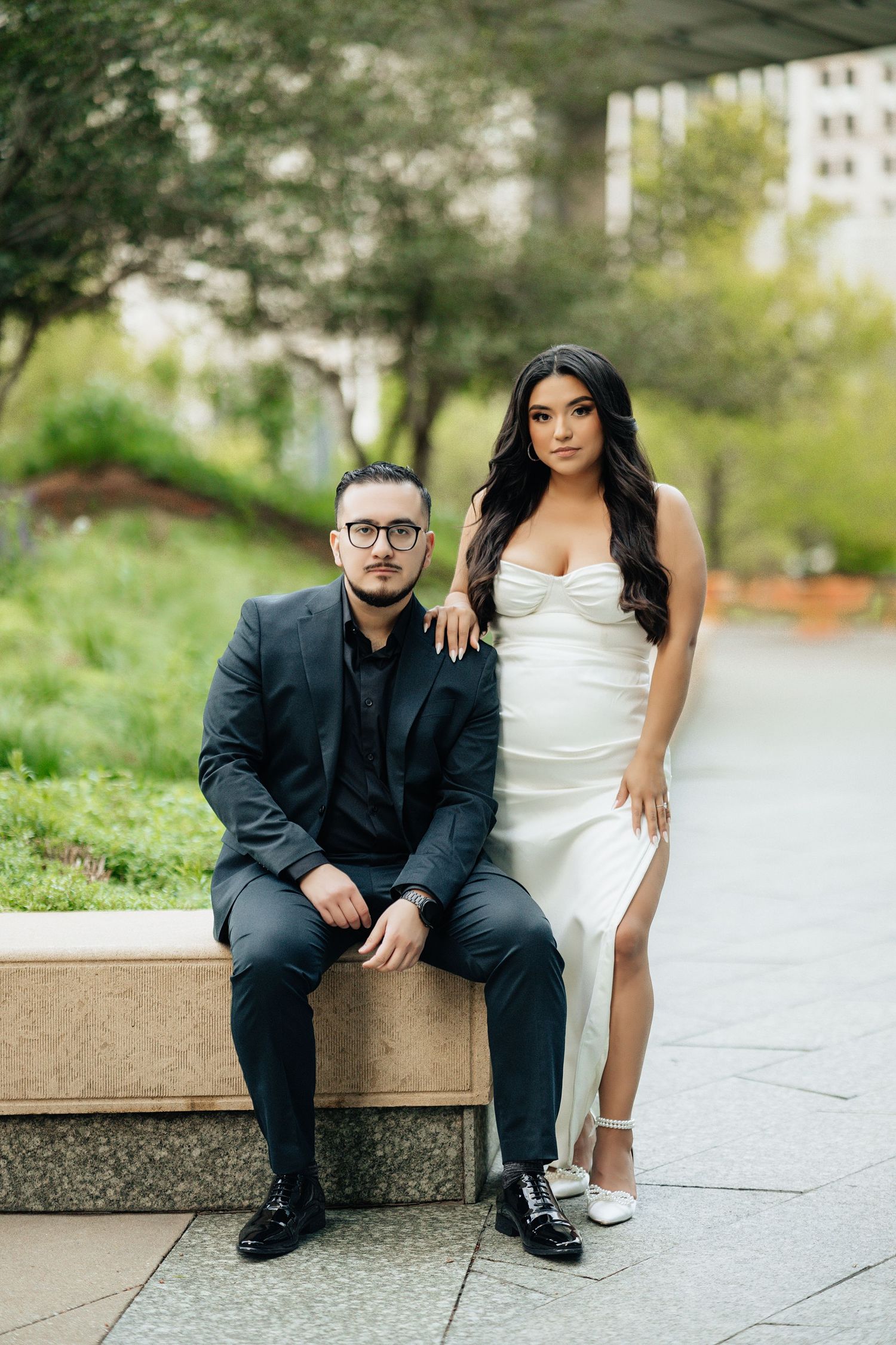 Bride and groom posing in an editorial manner during their engagement session.