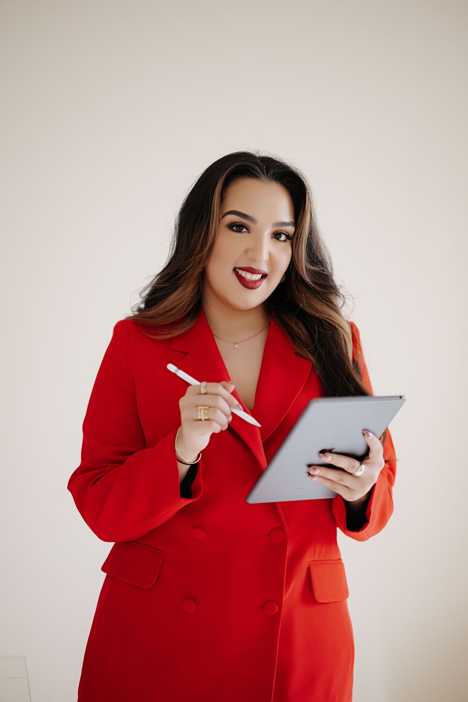 Detail shot of a woman in a red blazer. Branding photoshoot of an event planner.