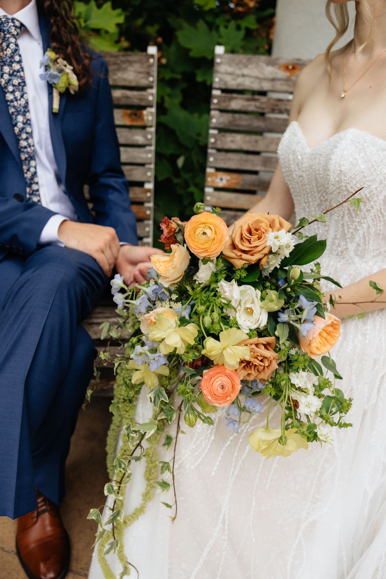 Bride and groom posing in an editorial manner during their wedding day.