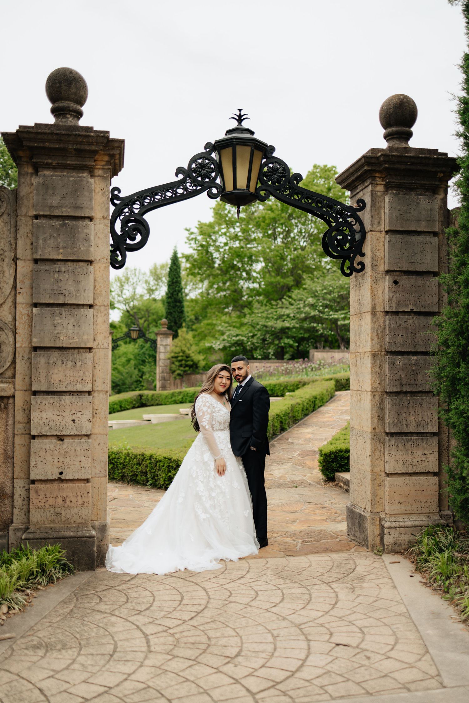 Bride and groom posing in an editorial manner during their wedding day.