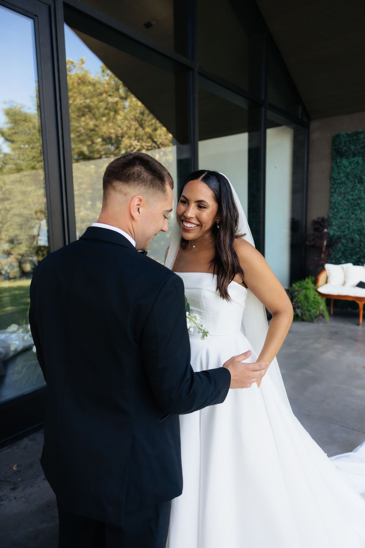 Bride and groom posing in an editorial manner during their wedding day.