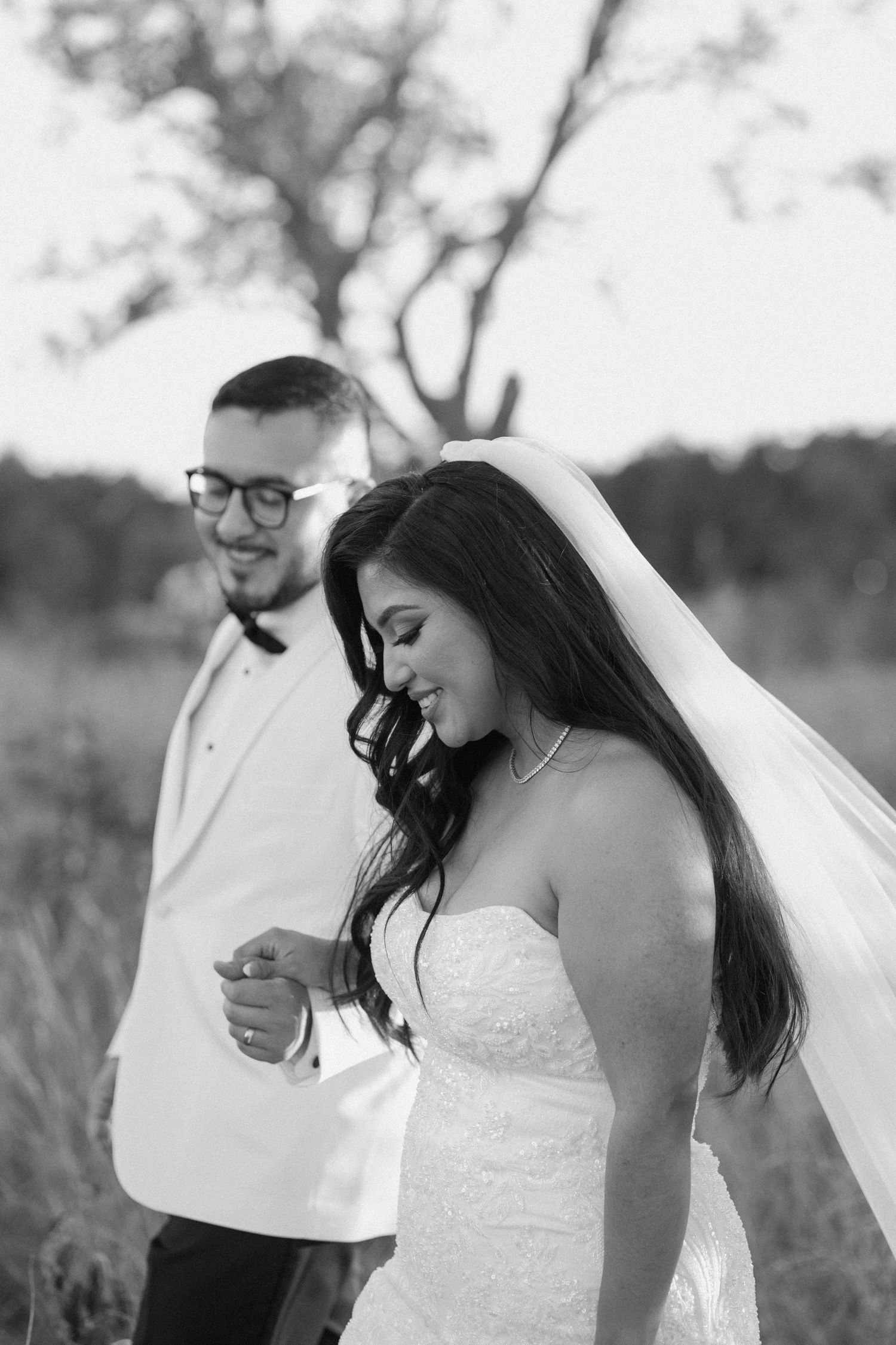 Bride and groom posing in an editorial manner during their wedding day.