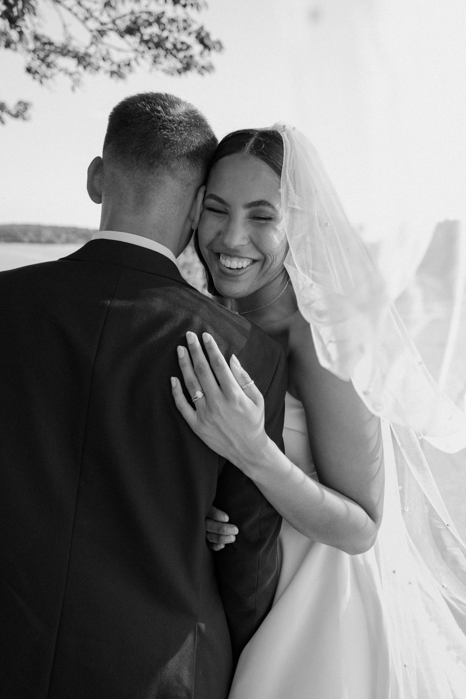 Bride and groom posing in an editorial manner during their wedding day.