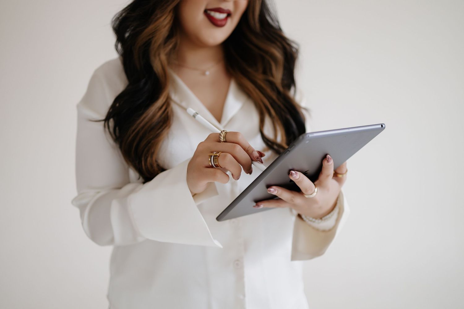 Detail shot of a woman in a white shirt. Branding photoshoot of an event planner.