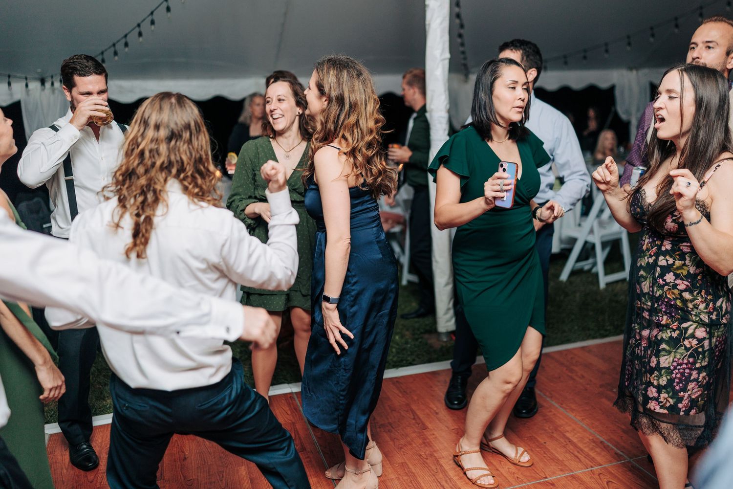 People dancing and having fun on a dance floor at a lively party or celebration event.